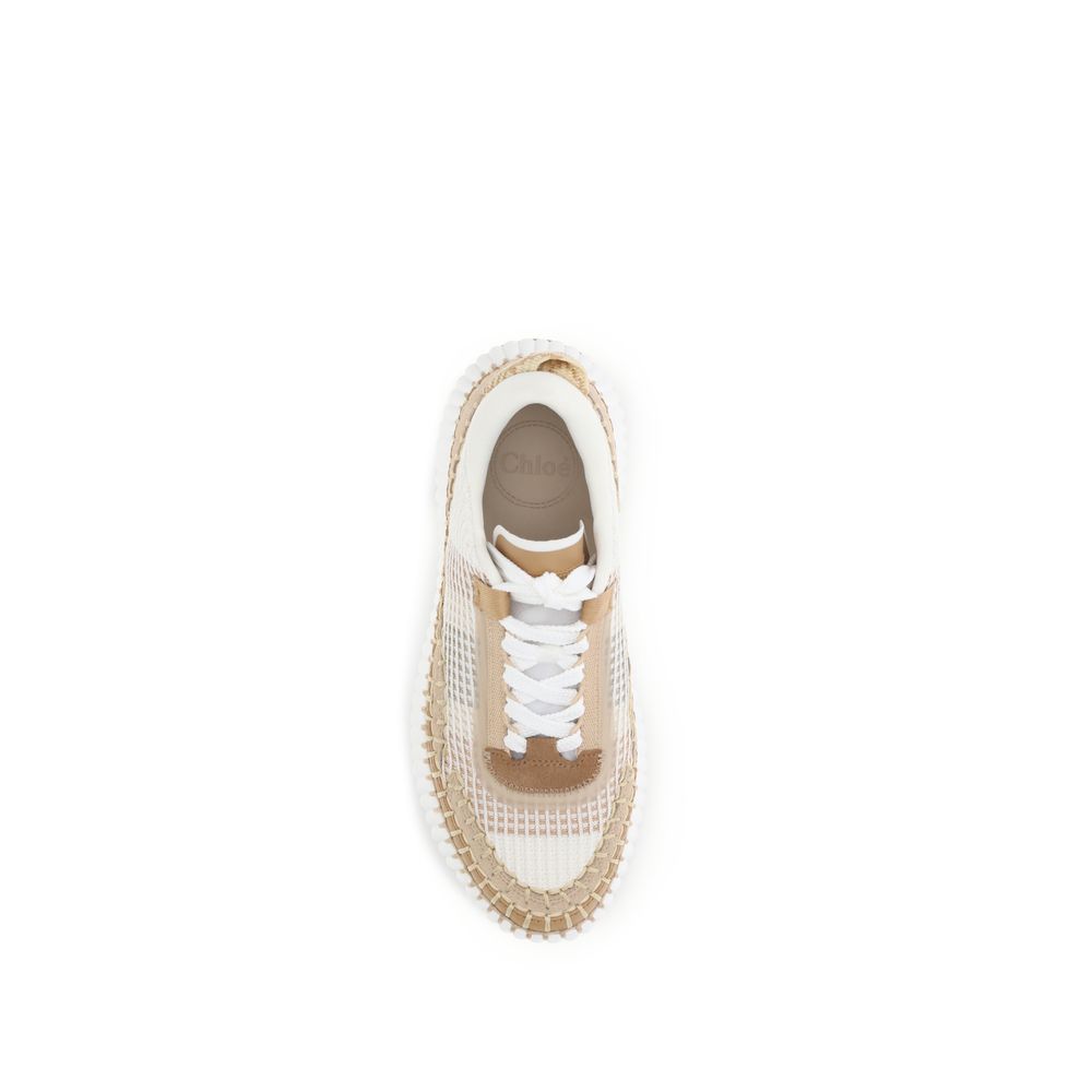 Elevate your style with Chloé's Nama Sneakers, crafted from recycled materials, blending contemporary design with sustainable luxury for the discerning individual.