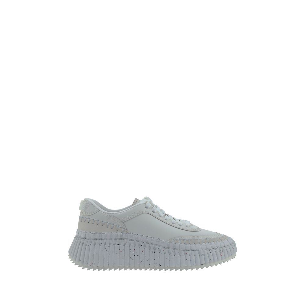 Elevate your style with Chloé's White Calf Leather Bos Taurus Platform Sneakers, a fusion of contemporary design and luxurious comfort, perfect for the modern connoisseur.