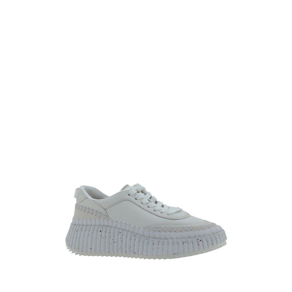 Indulge in the exquisite Chloé White Calf Leather Bos Taurus Platform Sneakers, where contemporary design meets luxurious comfort, perfect for elevating any modern ensemble.