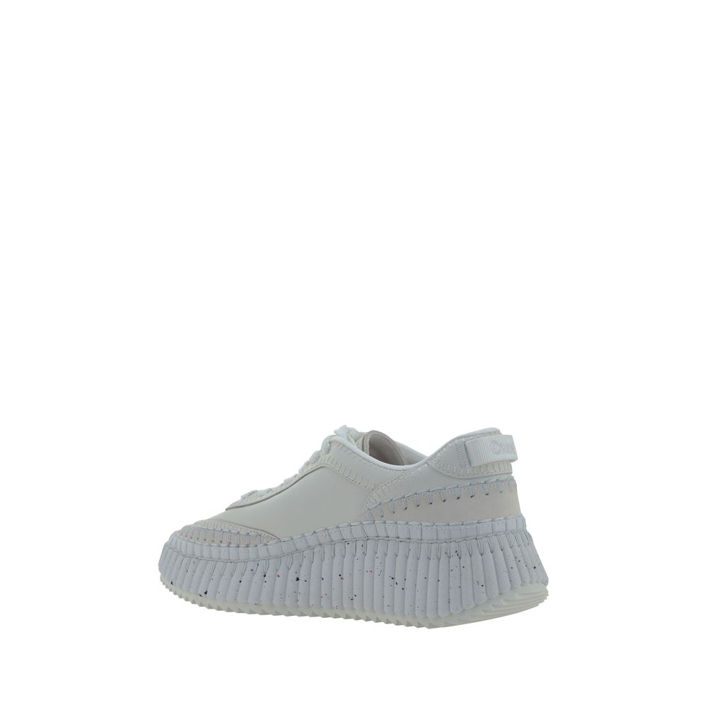 Elevate your style with Chloé's White Calf Leather Bos Taurus Platform Sneakers, where exquisite craftsmanship meets modern elegance for the discerning individual.