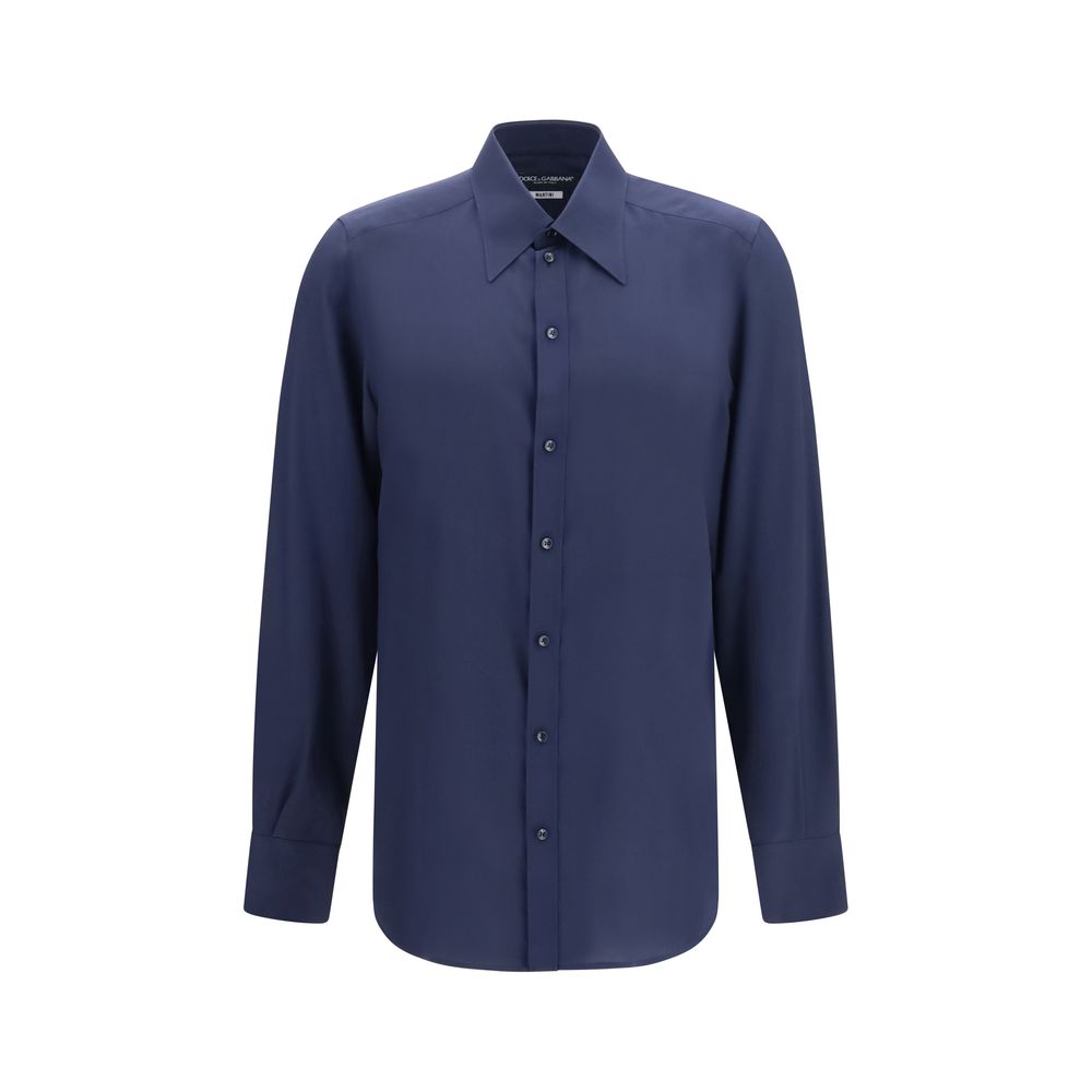 Experience the exquisite elegance of the Dolce & Gabbana Blue Silk Dress Shirt, a timeless masterpiece crafted from luxurious silk, embodying sophistication and prestige.