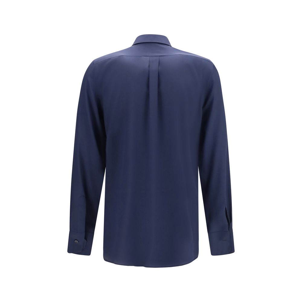 Elevate your wardrobe with the Dolce & Gabbana Blue Silk Dress Shirt, a masterpiece of refined crêpe de chine, embodying timeless elegance and sophisticated allure.