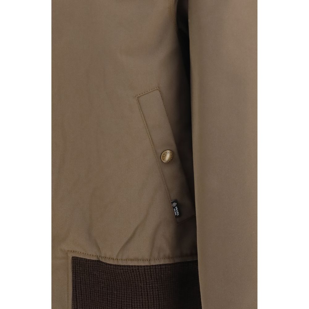Indulge in the exquisite Prada Brown Cotton Full-Length Jacket, featuring a luxurious corduroy collar and quilted lining, a timeless piece for the discerning wardrobe.
