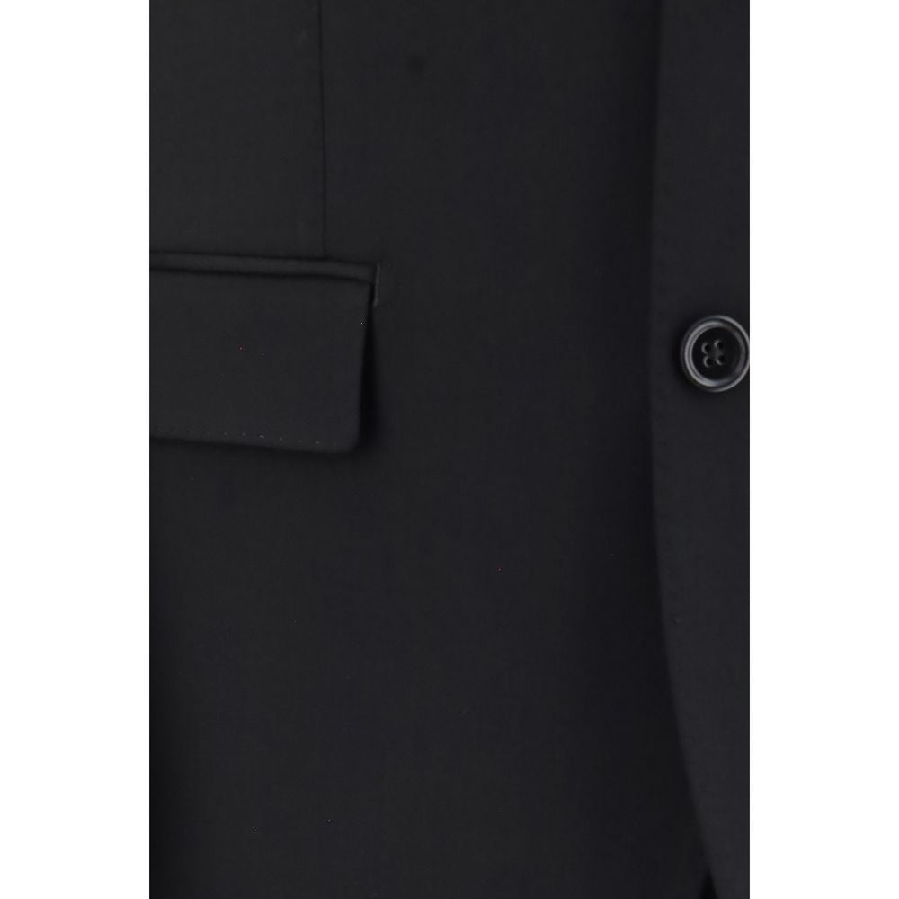 Indulge in the elegance of Dolce & Gabbana's Black Wool Oves Aries Two-Piece Suit, crafted from premium virgin wool gabardine, embodying timeless sophistication and Italian artistry.