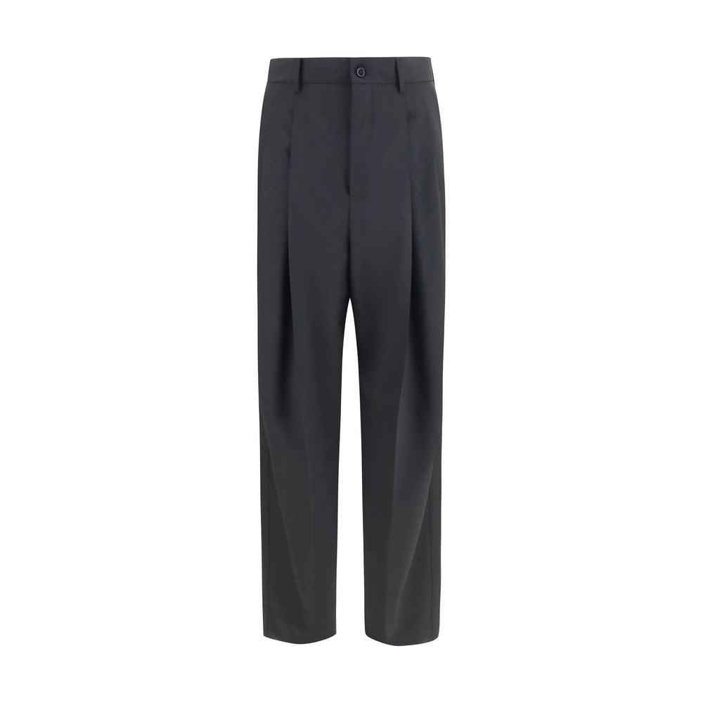 Experience the timeless elegance of Dolce & Gabbana's Black Wool Oves Aries Dress Pants, crafted from a luxurious wool blend for a sophisticated silhouette that defines refined style.