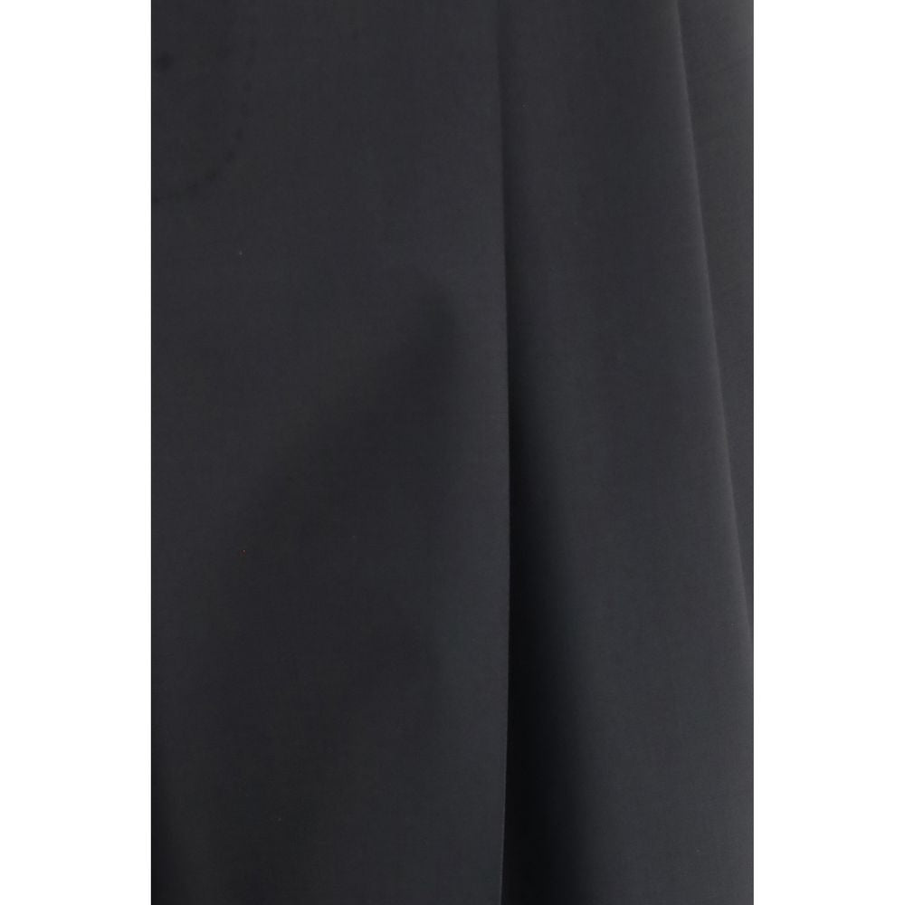 Indulge in the timeless elegance of Dolce & Gabbana's Black Wool Oves Aries Dress Pants, crafted from a luxurious wool blend for a sophisticated, polished look.