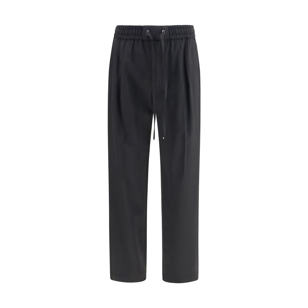Indulge in the refined elegance of Dolce & Gabbana's Black Wool Oves Aries Joggers, crafted from luxurious stretch virgin wool for a sophisticated, contemporary silhouette.