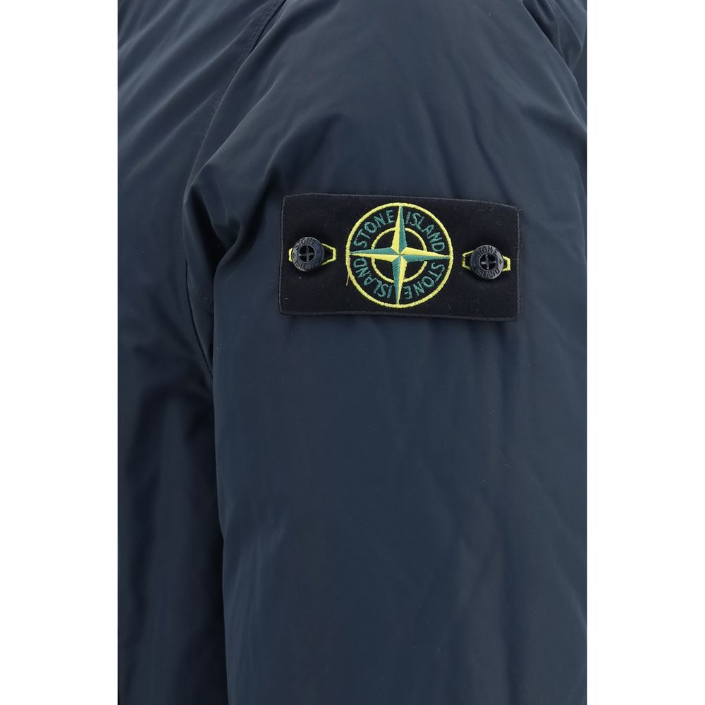 Indulge in the elegance of the Stone Island Blue Polyester Coat, a masterpiece of craftsmanship featuring luxurious down filling and a refined design for discerning tastes.