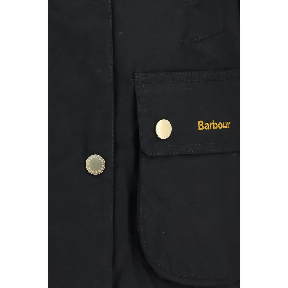 Discover the Barbour Black Cotton Full-Length Jacket, a refined blend of heritage style and modern femininity, perfect for the discerning individual seeking elegance and functionality.