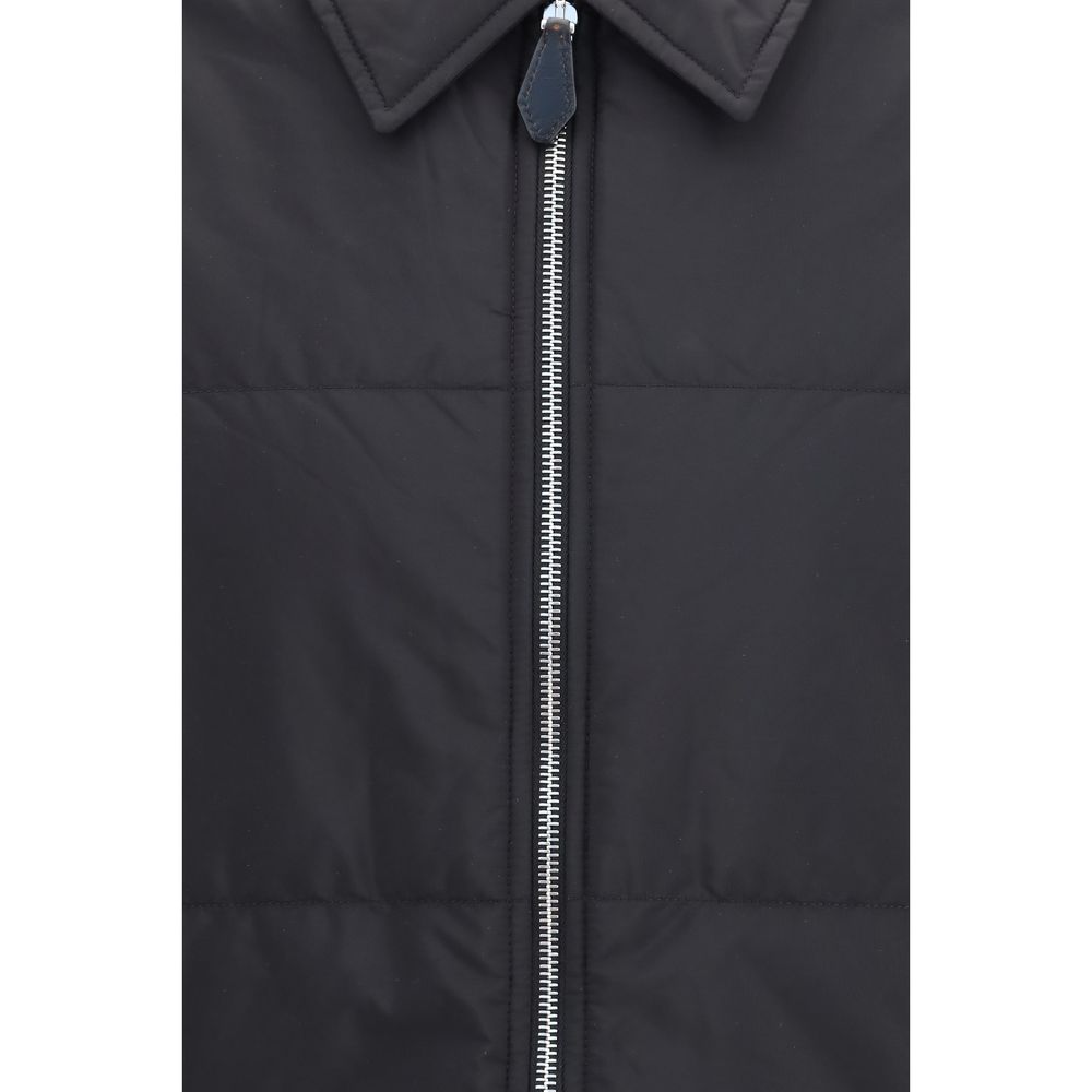 Discover the Prada Black Wool Oves Aries Full-Length Jacket, a masterpiece of refined craftsmanship and luxurious materials, designed for those who embody elegance and sophistication.