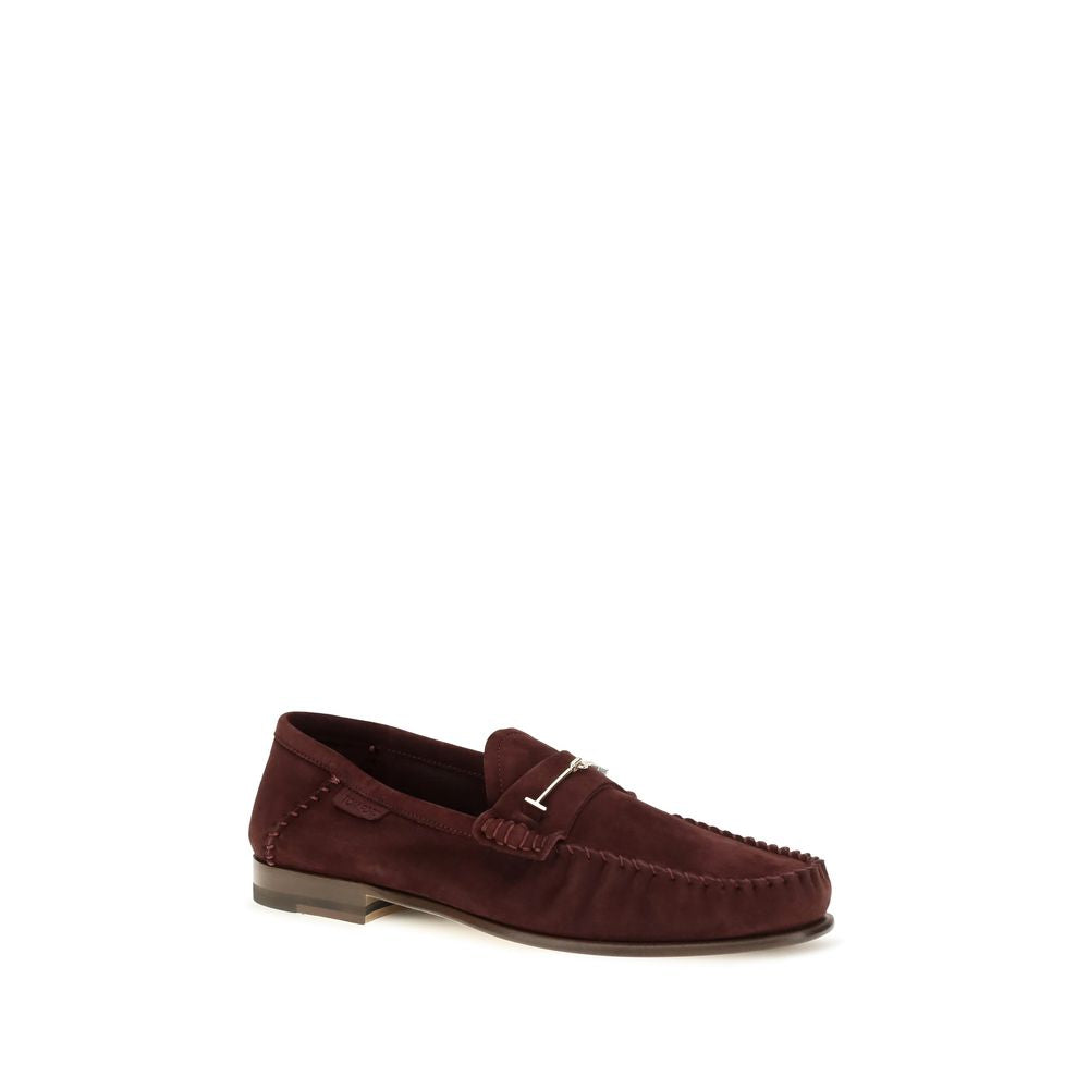 Indulge in the exquisite Tom Ford Bordeaux Calf Leather Bos Taurus Slip-On Loafers, where timeless craftsmanship meets sophisticated allure for the discerning connoisseur.