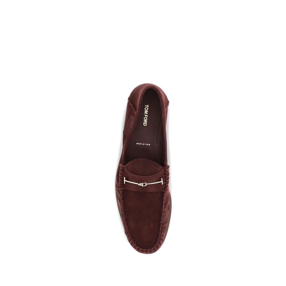 Discover the exquisite Tom Ford Bordeaux Calf Leather Bos Taurus Slip-On Loafers, where luxurious suede meets sophisticated design, perfect for the discerning individual.