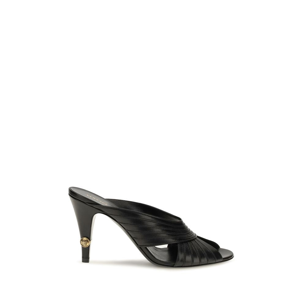 Indulge in the elegance of Versace's Black Lamb Ovis Aries Mules, crafted from sumptuous nappa leather, where bold sophistication meets timeless luxury.