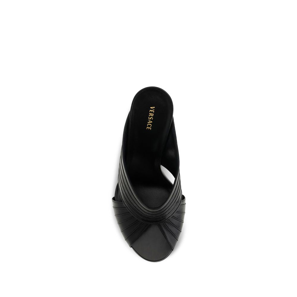 Indulge in the elegance of Versace's Black Lamb Ovis Aries Aries Mules, where exquisite nappa leather meets iconic Medusa hardware for a statement of refined luxury.