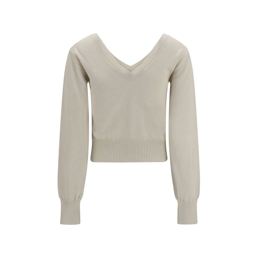 Indulge in the exquisite Beatrice V-neck Sweater by Vivienne Westwood, crafted from a luxurious cotton and cashmere blend, embodying effortless elegance for the discerning individual.