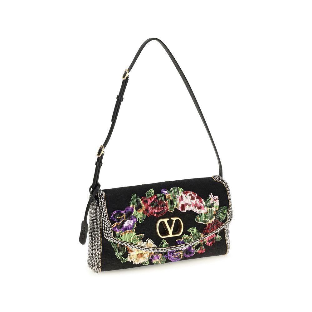 Discover the Valentino Garavani Multicolor Linen Shoulder Bag, a masterpiece of floral bead embroidery and elegant design, perfect for those who appreciate true luxury.