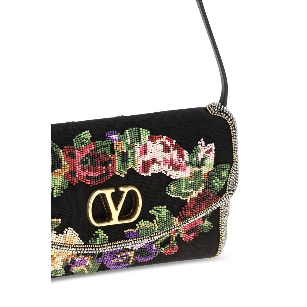 Indulge in the exquisite Valentino Garavani Multicolor Linen Shoulder Bag, a masterpiece of floral bead embroidery and refined design, perfect for the discerning connoisseur.