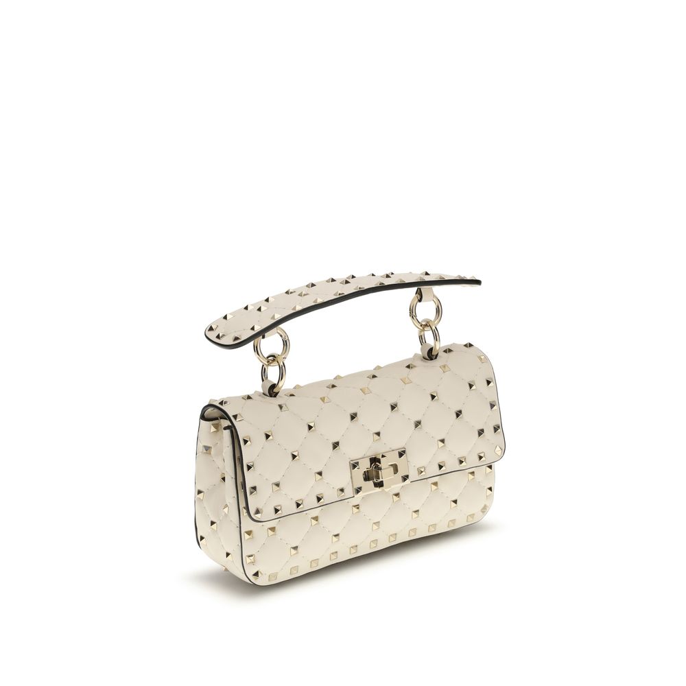 Experience the allure of the Valentino Garavani Rockstud Spike mini Top Handle Bag, a masterpiece in quilted lamb nappa leather, embodying timeless elegance and sophistication.