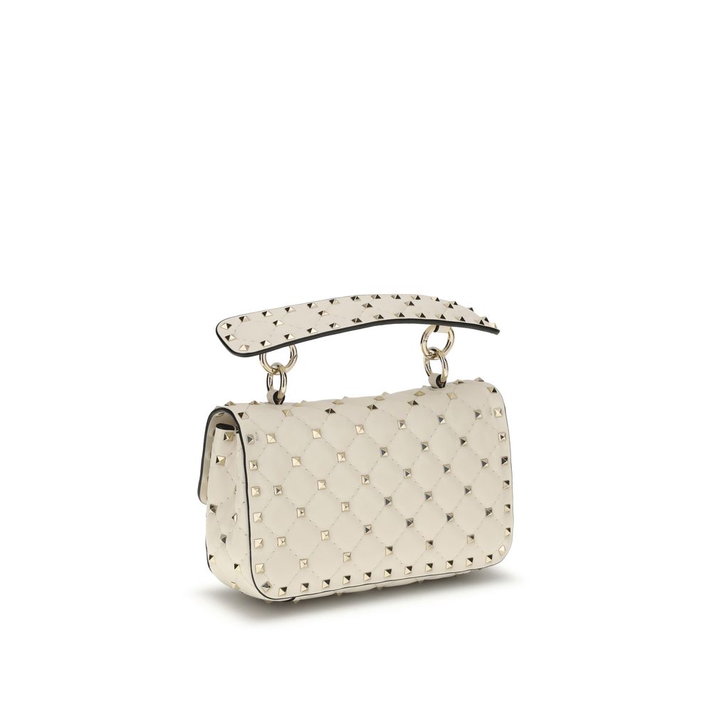 Indulge in the elegance of the Valentino Garavani Beige Lamb Ovis Aries Aries Handbag, a masterpiece of quilted nappa leather and signature Rockstuds, embodying timeless luxury.