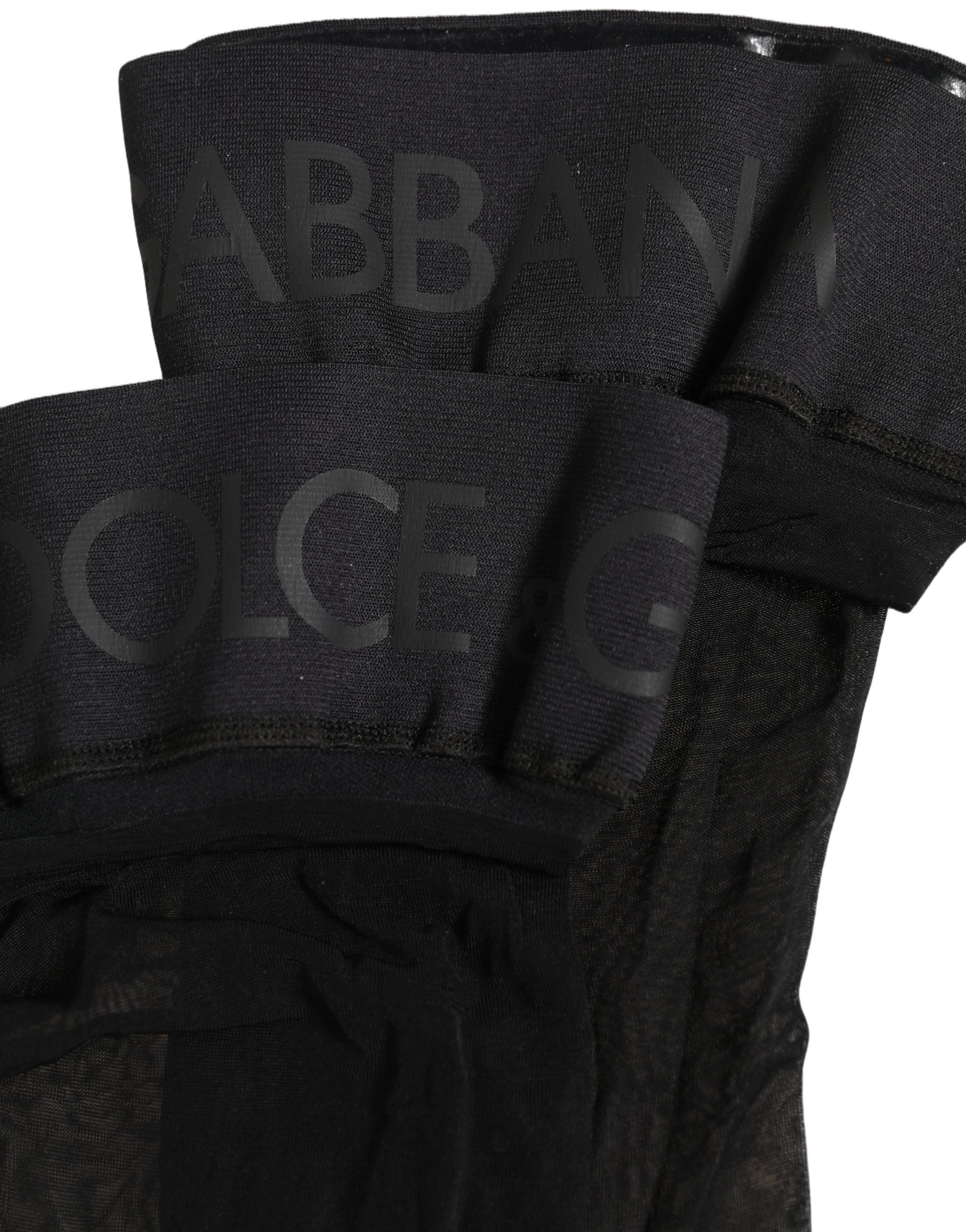 Indulge in the exquisite allure of Dolce & Gabbana's Black Nylon Logo Calf Long Socks, crafted from premium nylon for unparalleled comfort and sophistication.
