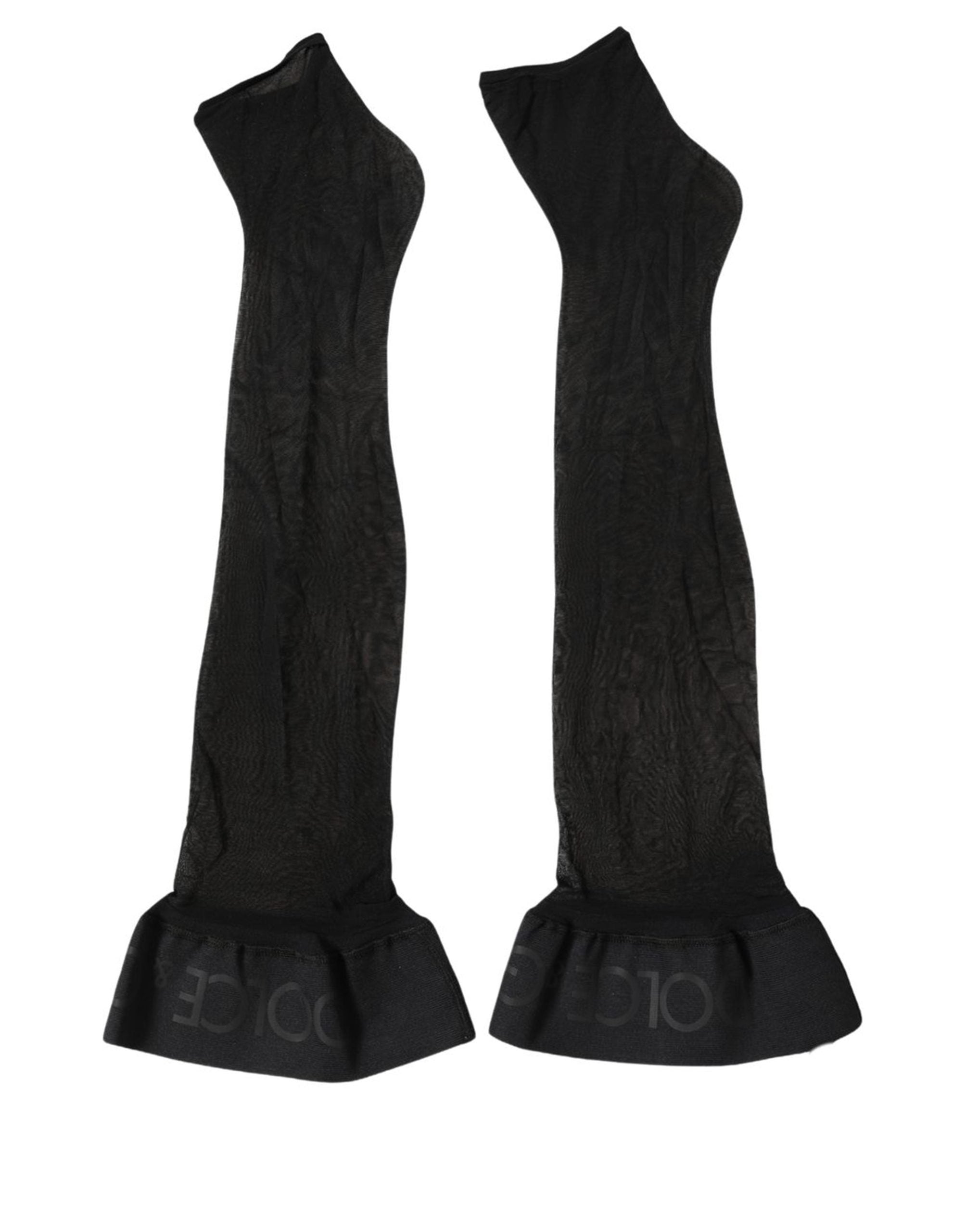 Indulge in the exquisite allure of Dolce & Gabbana's Black Nylon Logo Calf Long Socks, where unparalleled craftsmanship meets timeless luxury for discerning tastes.