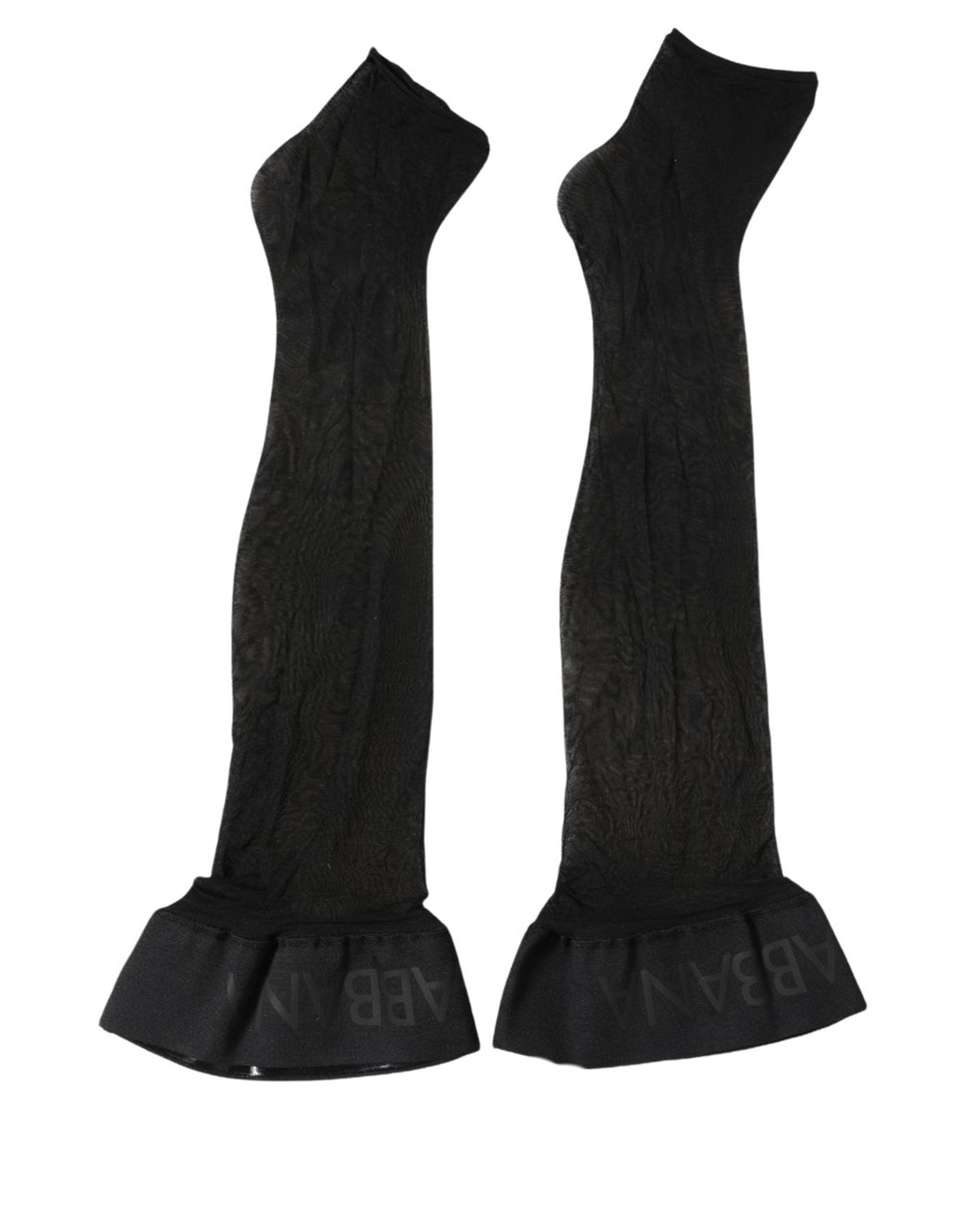 Indulge in the exquisite allure of Dolce & Gabbana's Black Nylon Logo Calf Long Socks, crafted in Italy with luxurious materials, embodying timeless elegance and sophistication.