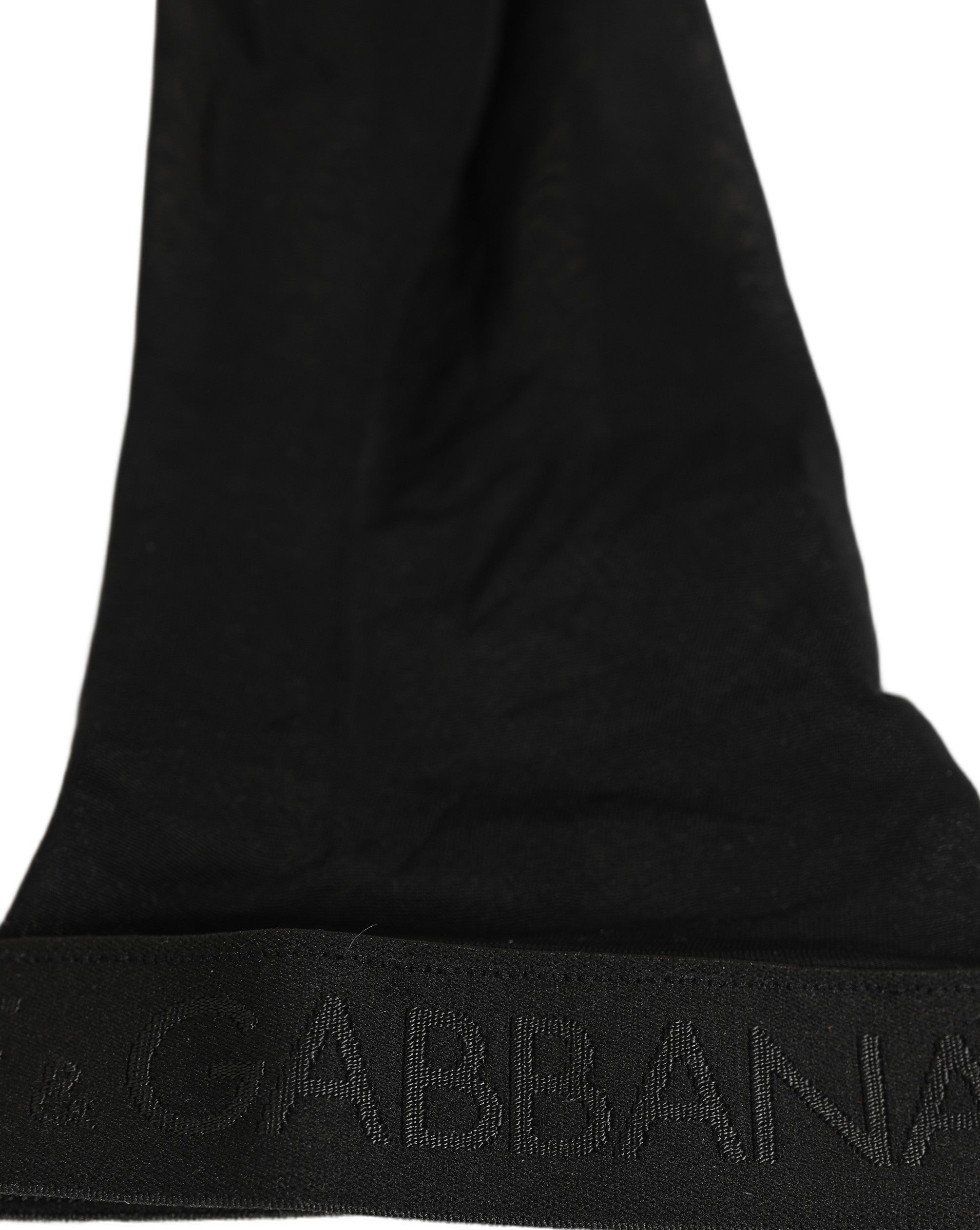 Indulge in the exquisite allure of Dolce & Gabbana's Black Nylon Logo Calf Long Socks, where Italian craftsmanship meets luxurious comfort for the discerning individual.