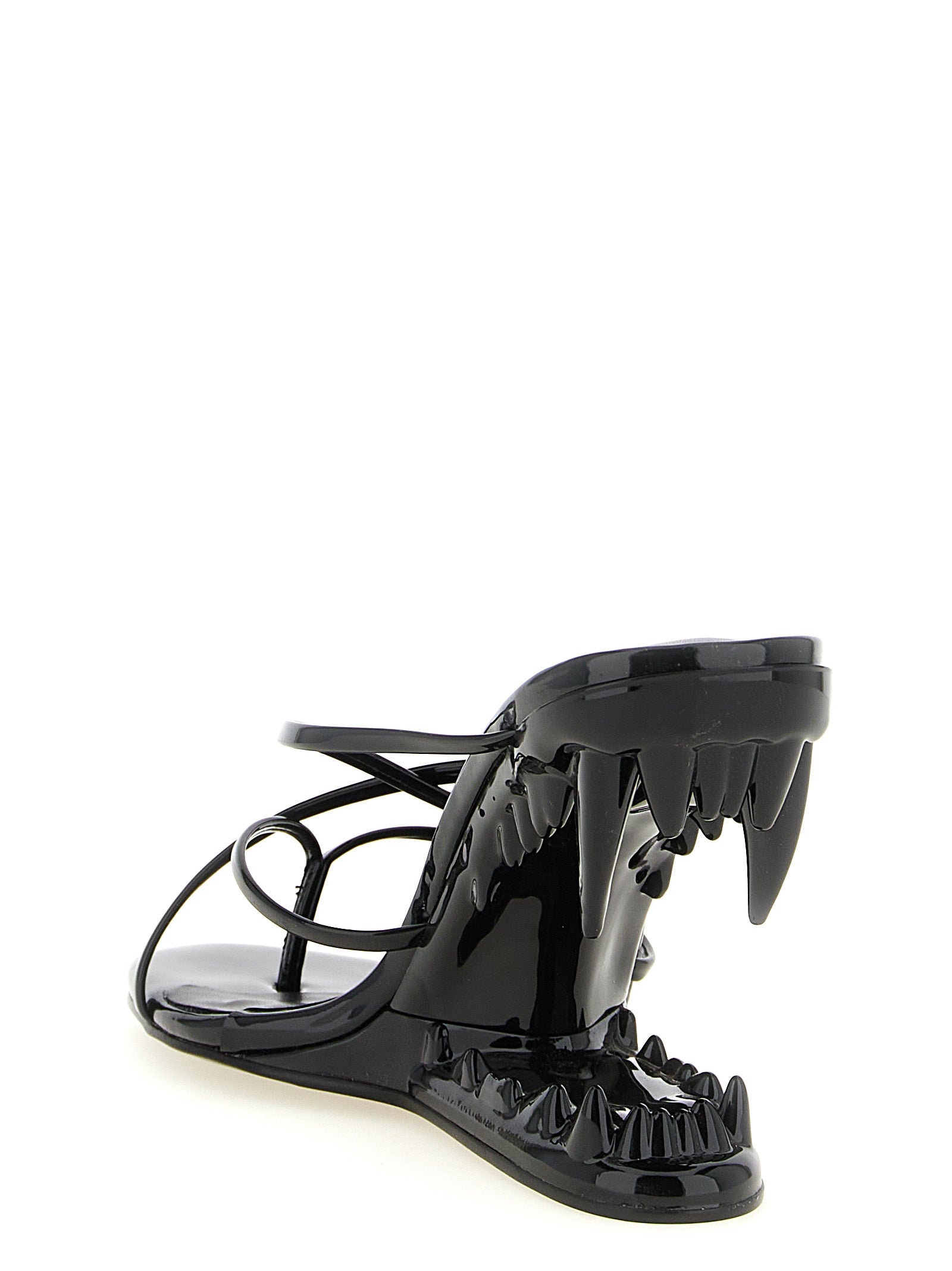 Step into a realm of elegance with GCDS Morso Thong sandals, where high-shine patent leather meets architectural design, embodying luxury and sophistication.