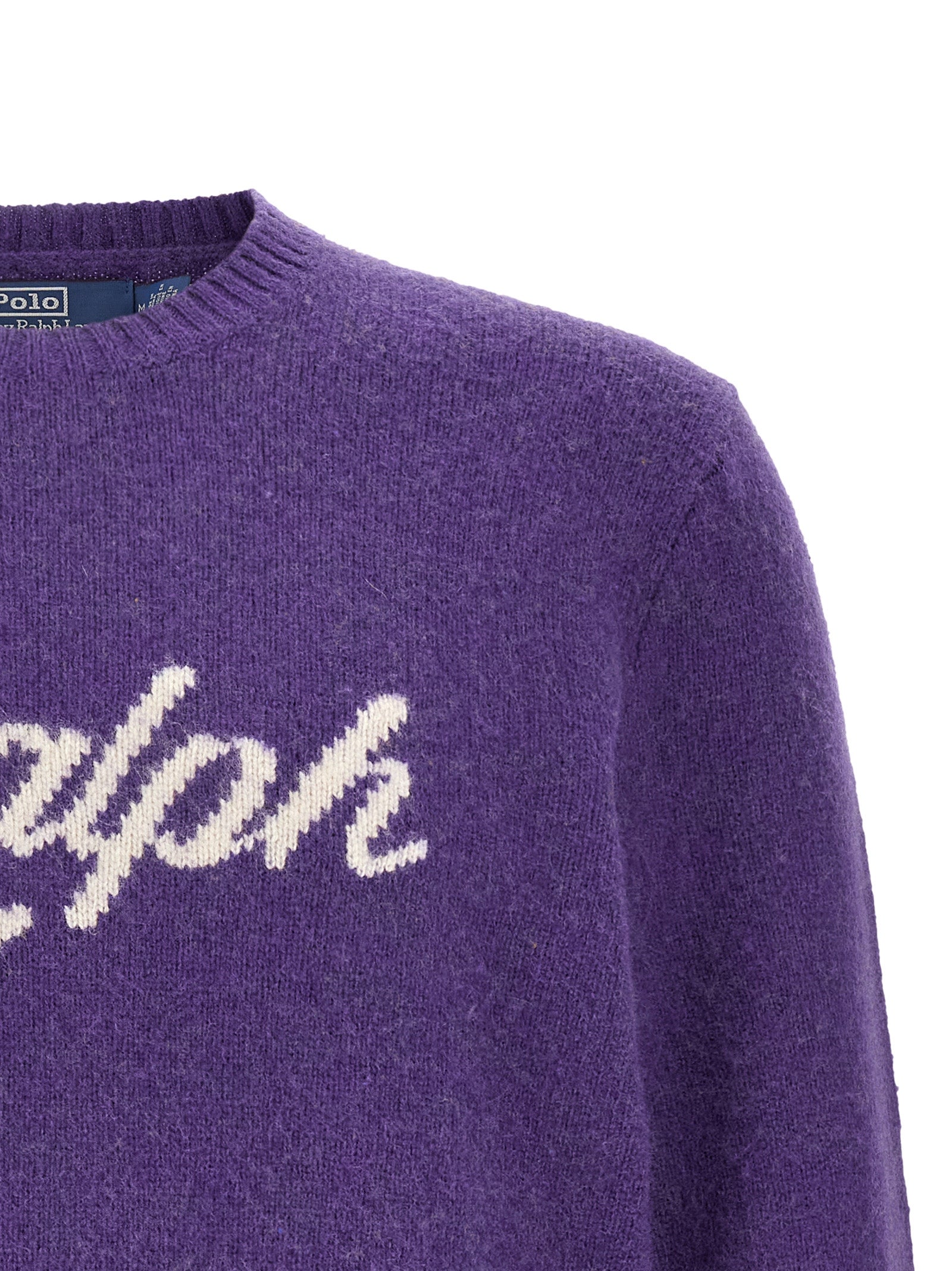 Indulge in the exquisite Polo Ralph Lauren Purple Wool Cardigan, a timeless blend of wool and cashmere that elevates your style with luxurious comfort and sophistication.