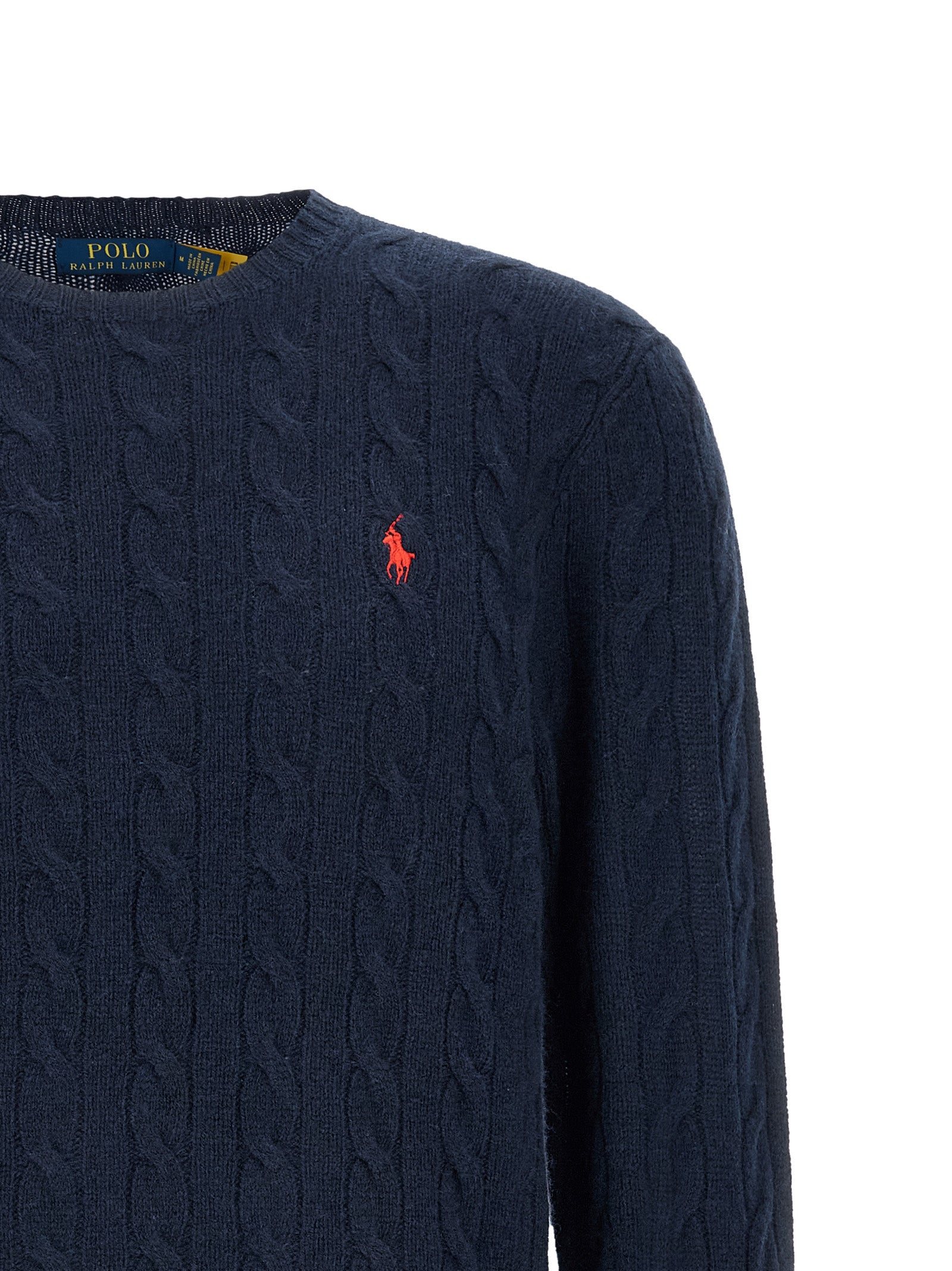 Experience the exquisite allure of the Polo Ralph Lauren Blue Wool Cardigan, a luxurious blend of wool and cashmere that embodies timeless elegance and sophistication.