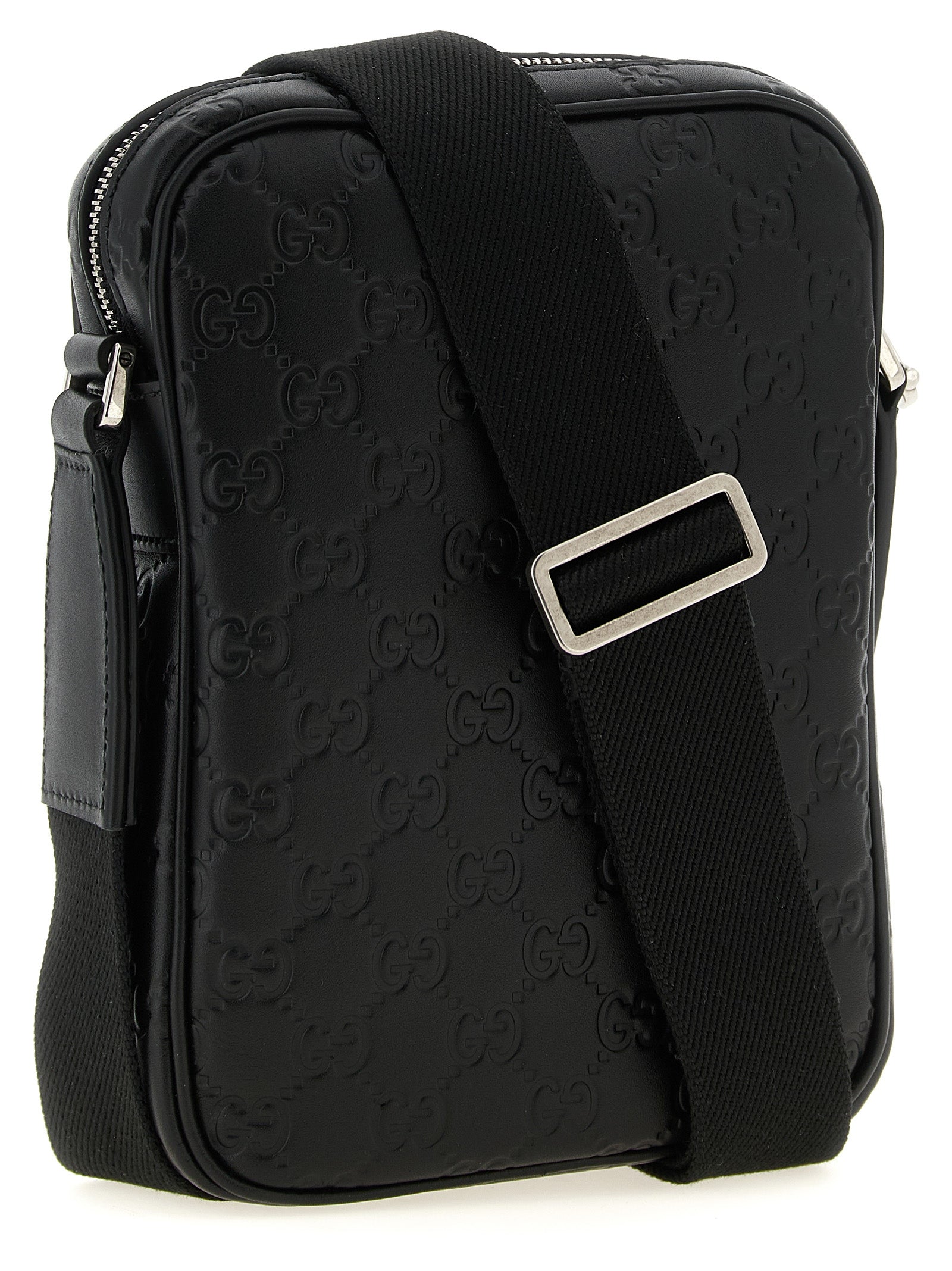 Discover the Gucci Black Calfskin Crossbody Bag, a masterpiece of Italian craftsmanship adorned with an embossed GG pattern, elevating your style with luxurious sophistication.