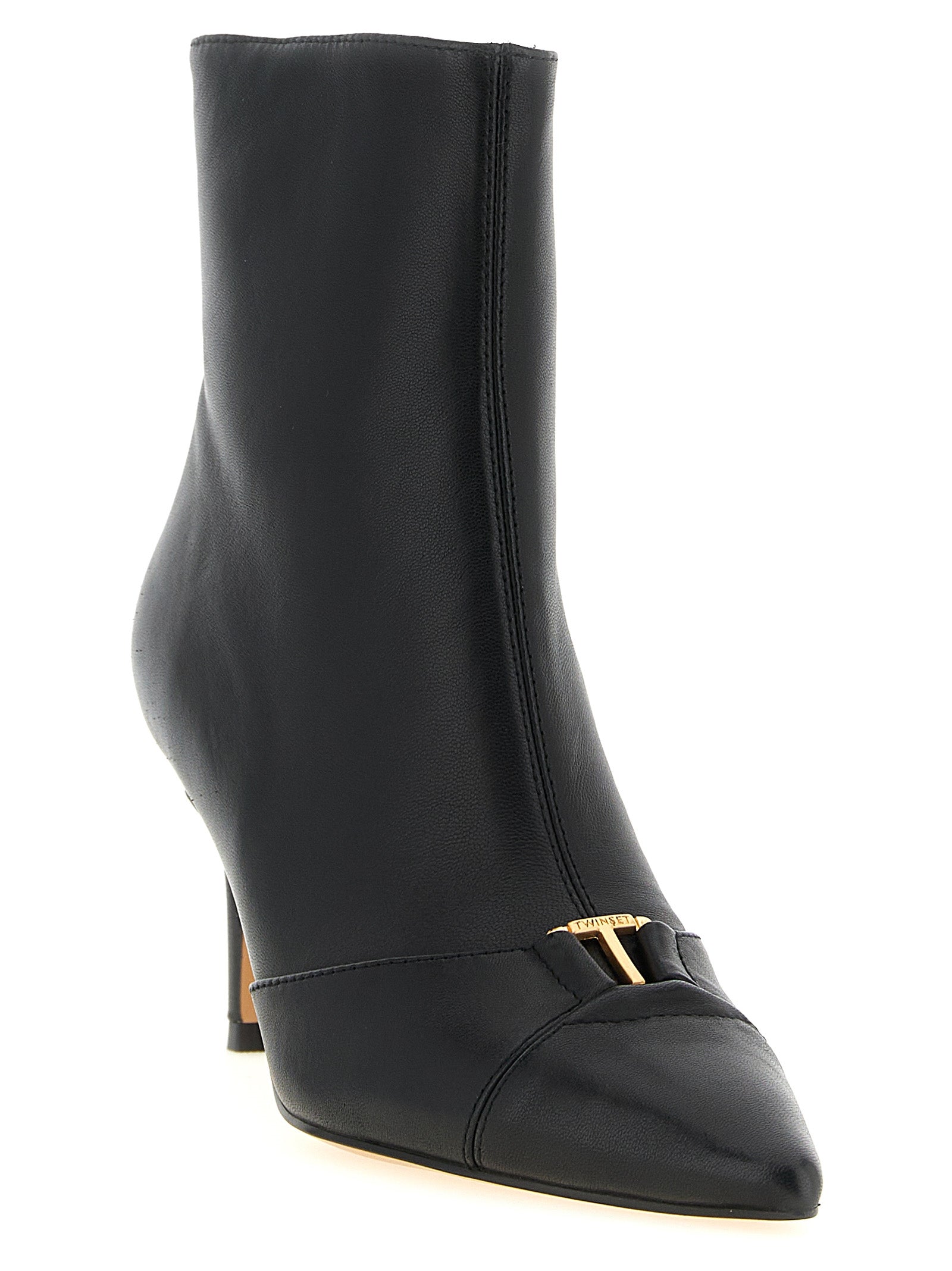 Step into sophistication with Twinset's Black Leather Ankle Boots, where exquisite craftsmanship meets timeless elegance, perfect for the discerning individual.