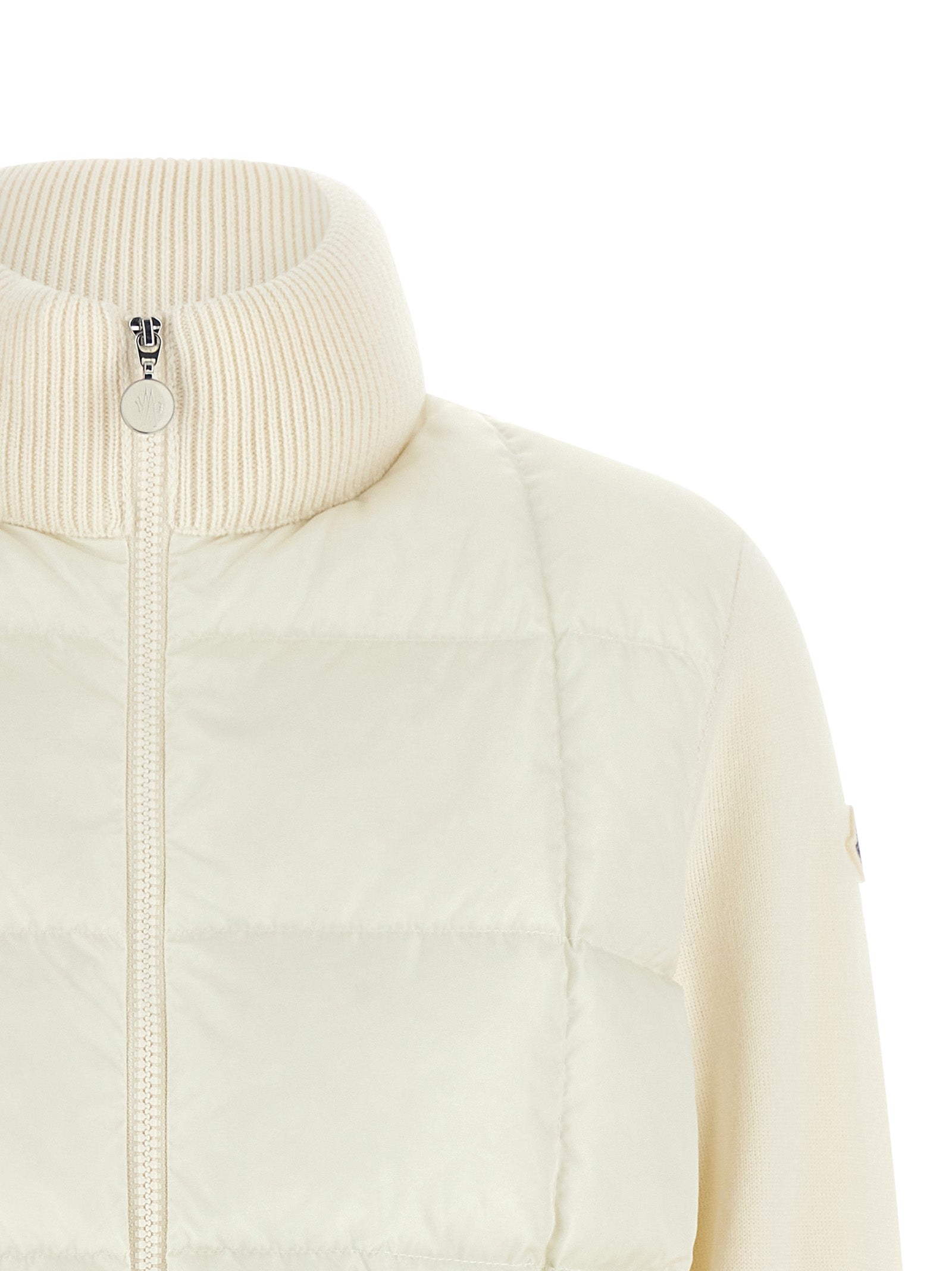 Experience the epitome of elegance with the Moncler White Virgin Wool Full-Length Jacket, a luxurious blend of sophistication and warmth, perfect for stylish transitions.