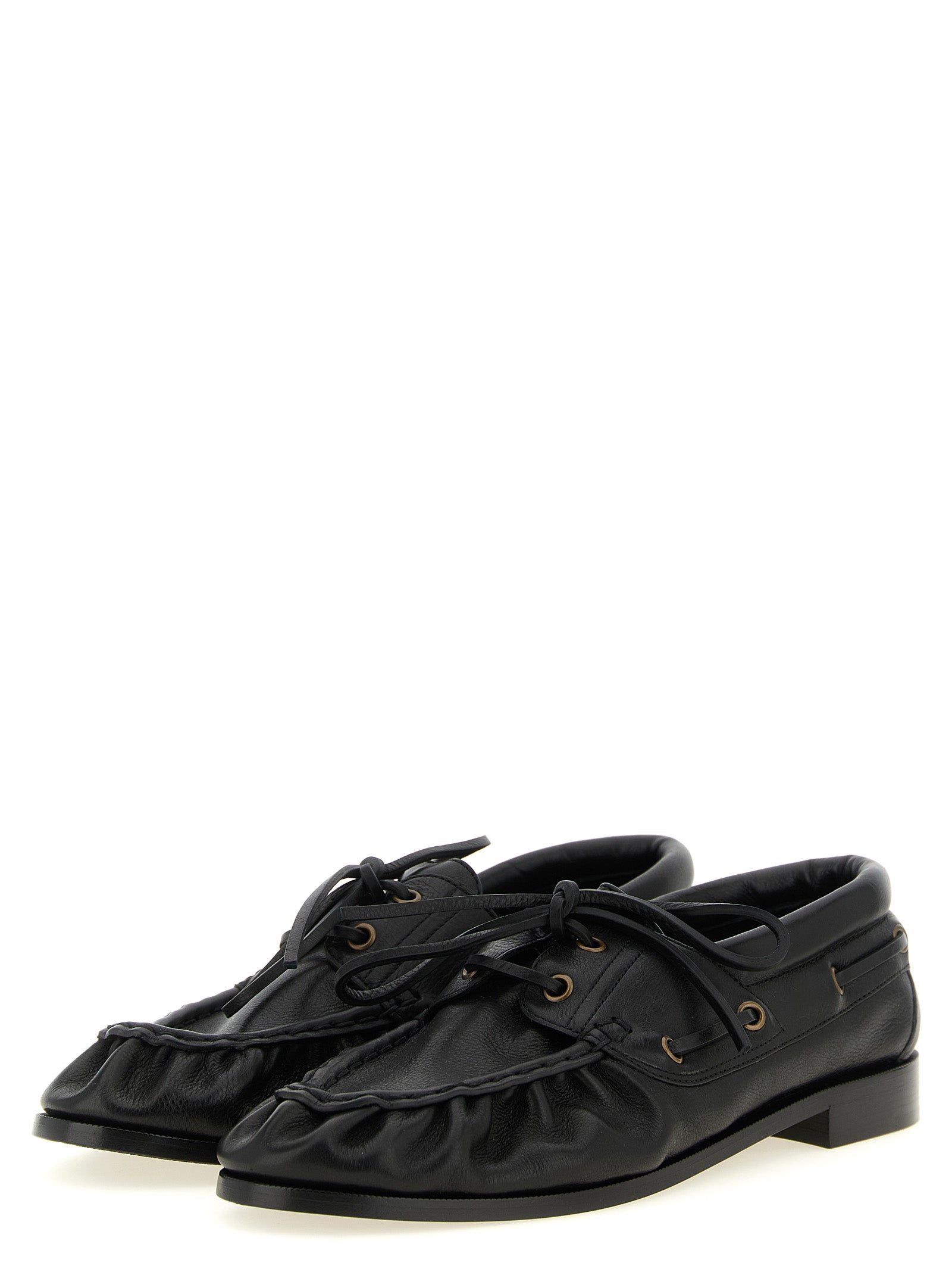 Indulge in the elegance of Saint Laurent's Black Calfskin Slip-On Loafers, where exquisite craftsmanship meets timeless sophistication for the discerning connoisseur.