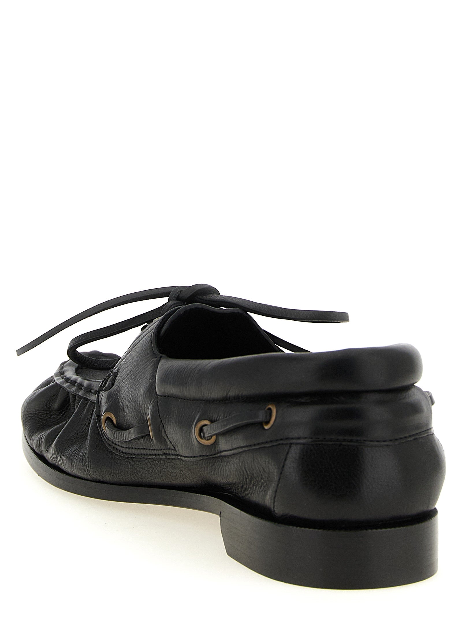 Indulge in the elegance of Saint Laurent's Black Calfskin Slip-On Loafers, where timeless craftsmanship meets modern sophistication for the discerning individual.
