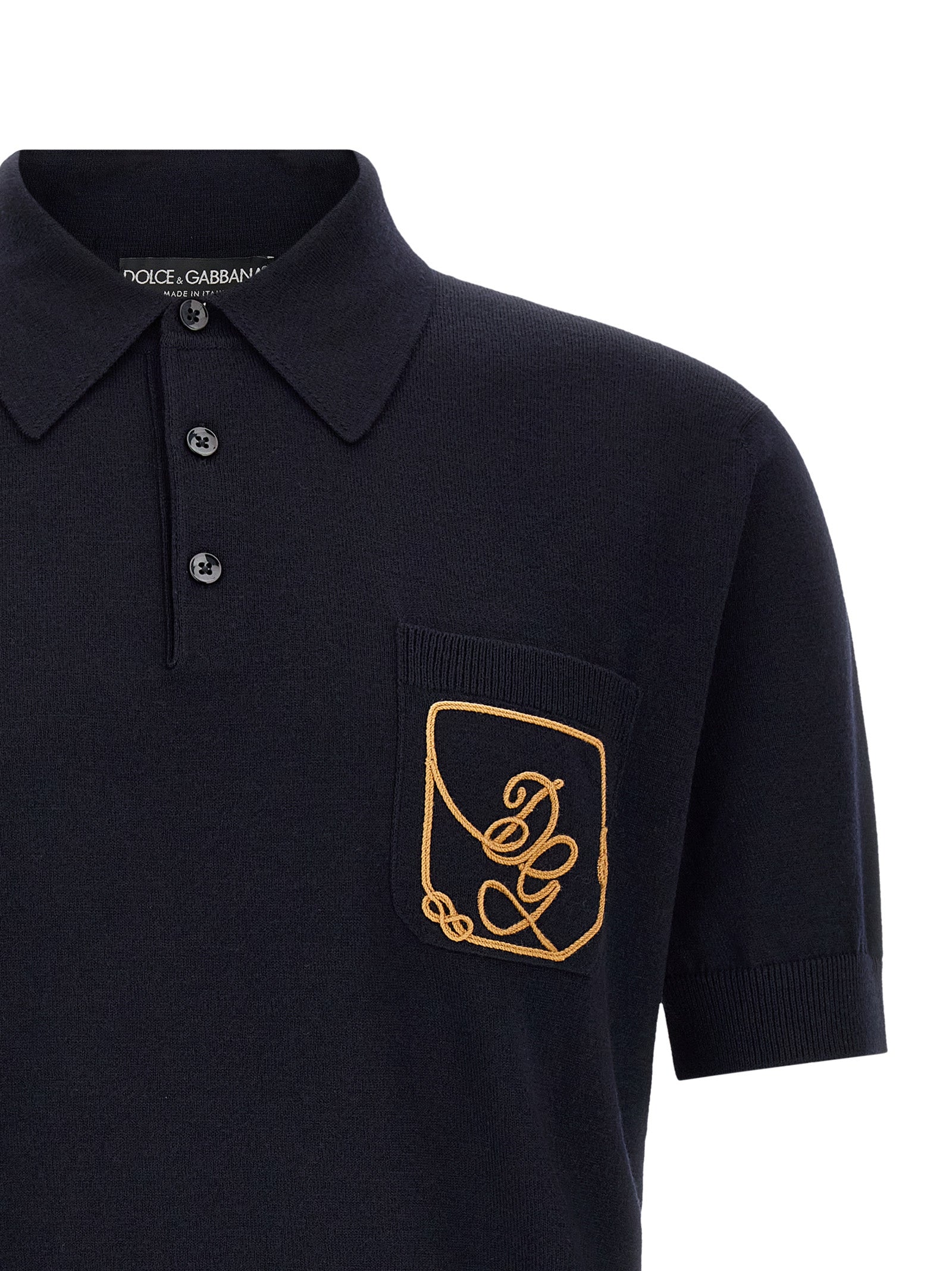 Experience the exquisite allure of Dolce & Gabbana's Blue Virgin Wool Polo Shirt, a timeless piece crafted from luxurious virgin wool, embodying sophistication and Italian craftsmanship.