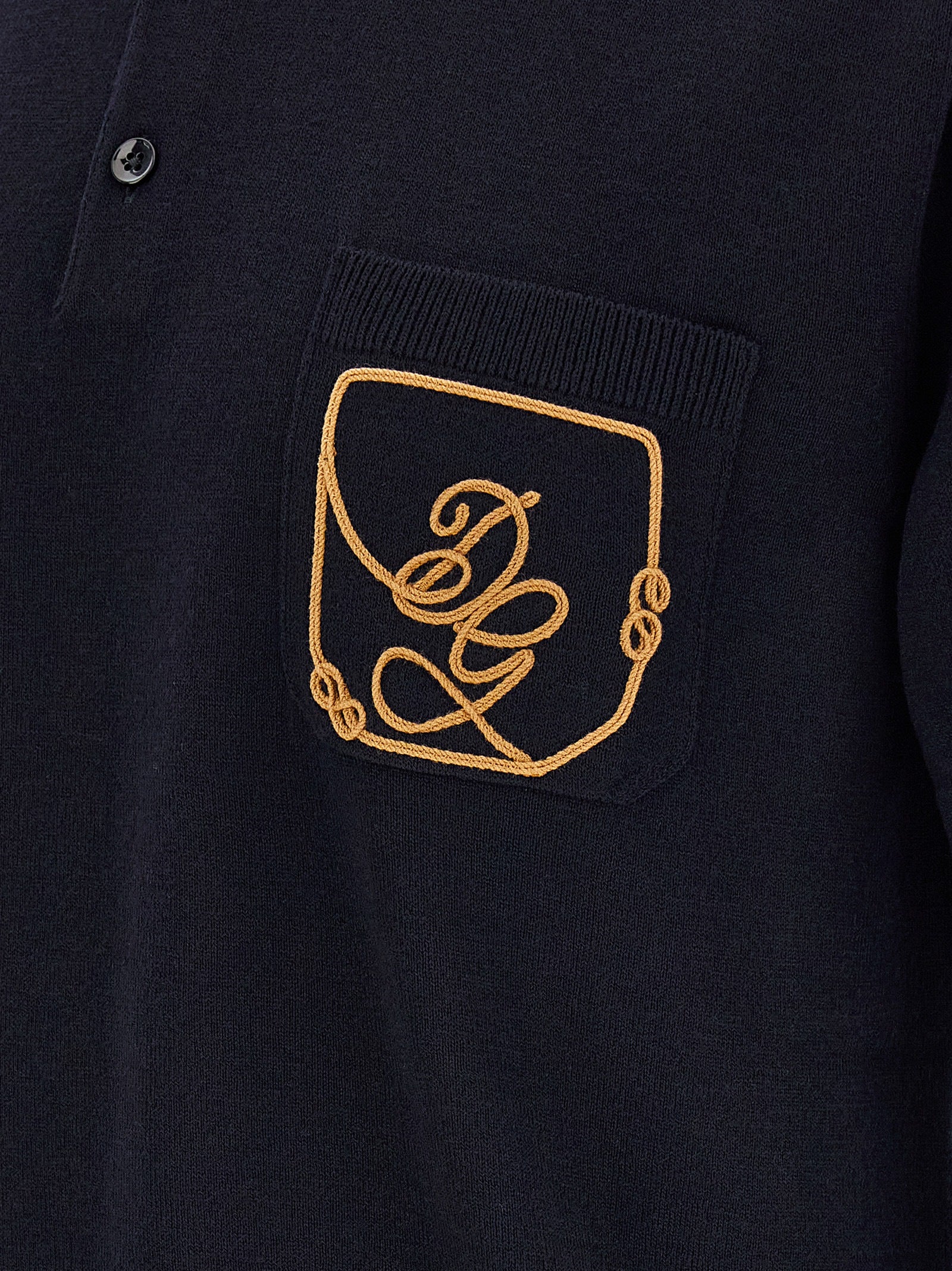 Indulge in the exquisite craftsmanship of Dolce & Gabbana's Blue Virgin Wool Polo Shirt, a timeless staple that embodies sophistication and luxury for the discerning individual.