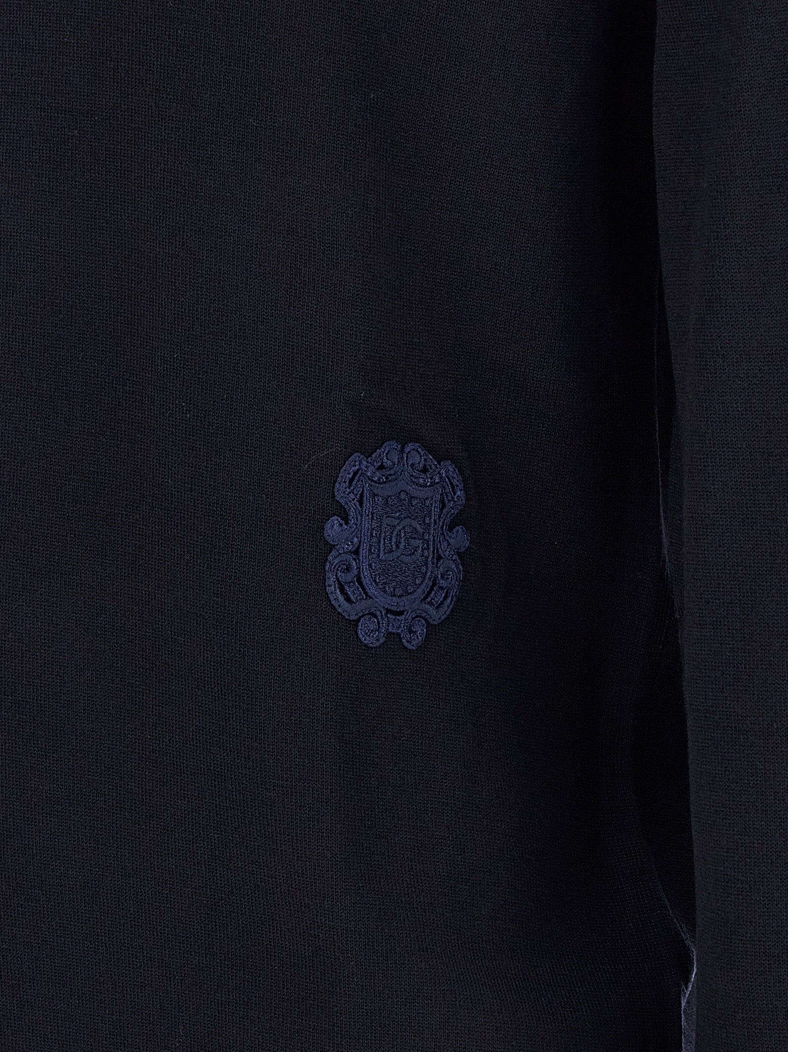 Indulge in the exquisite Dolce & Gabbana Blue Virgin Wool Cardigan, a masterpiece of fine craftsmanship that embodies timeless elegance and sophisticated allure.