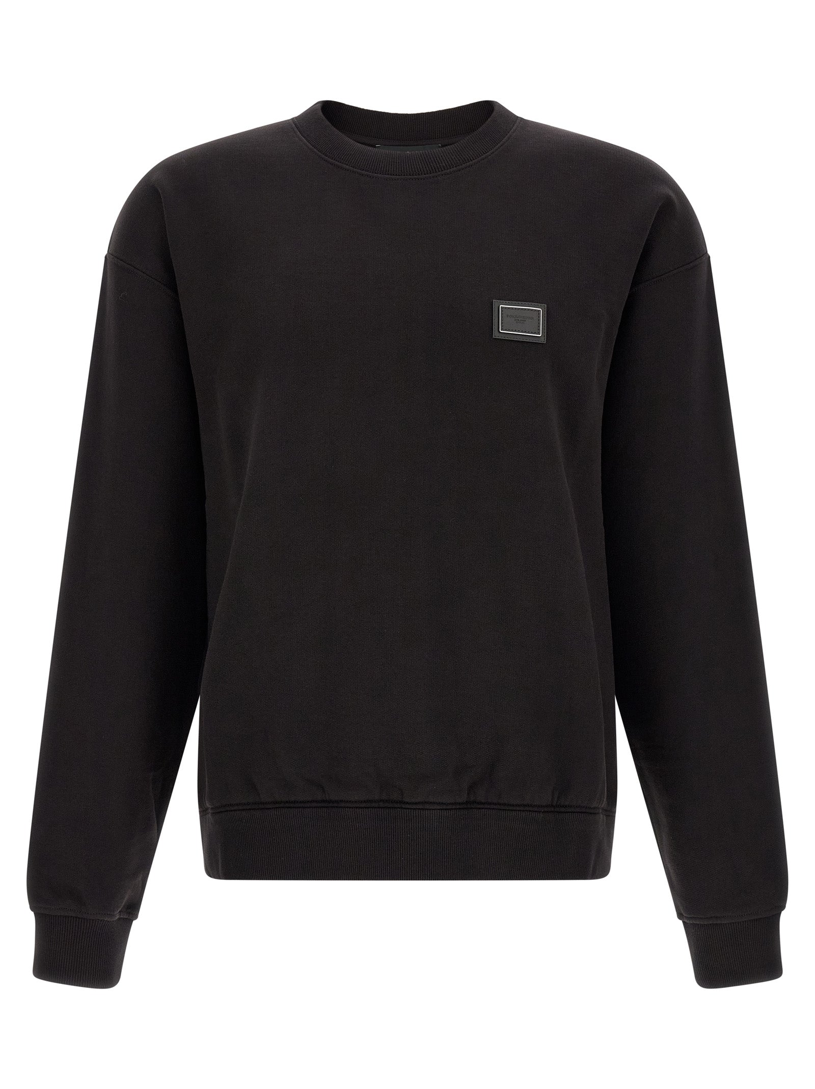 Indulge in the elegance of Dolce & Gabbana's Black Cotton Sweatshirt, a masterpiece of refined craftsmanship that elevates your casual wardrobe with luxurious comfort and timeless style.