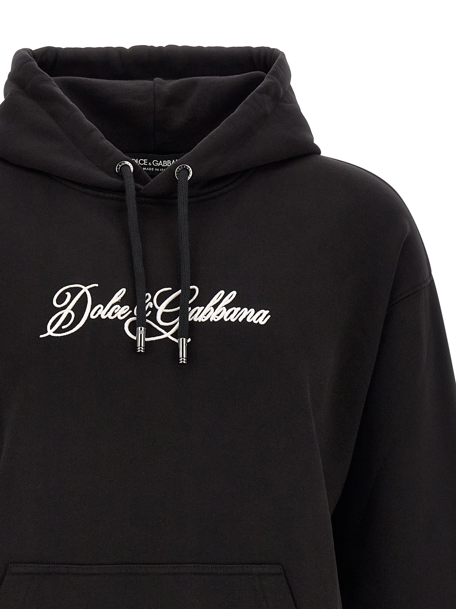 Indulge in the elegance of Dolce & Gabbana's Black Cotton Sweatshirt, where luxurious comfort meets sophisticated style, perfect for the discerning fashion connoisseur.