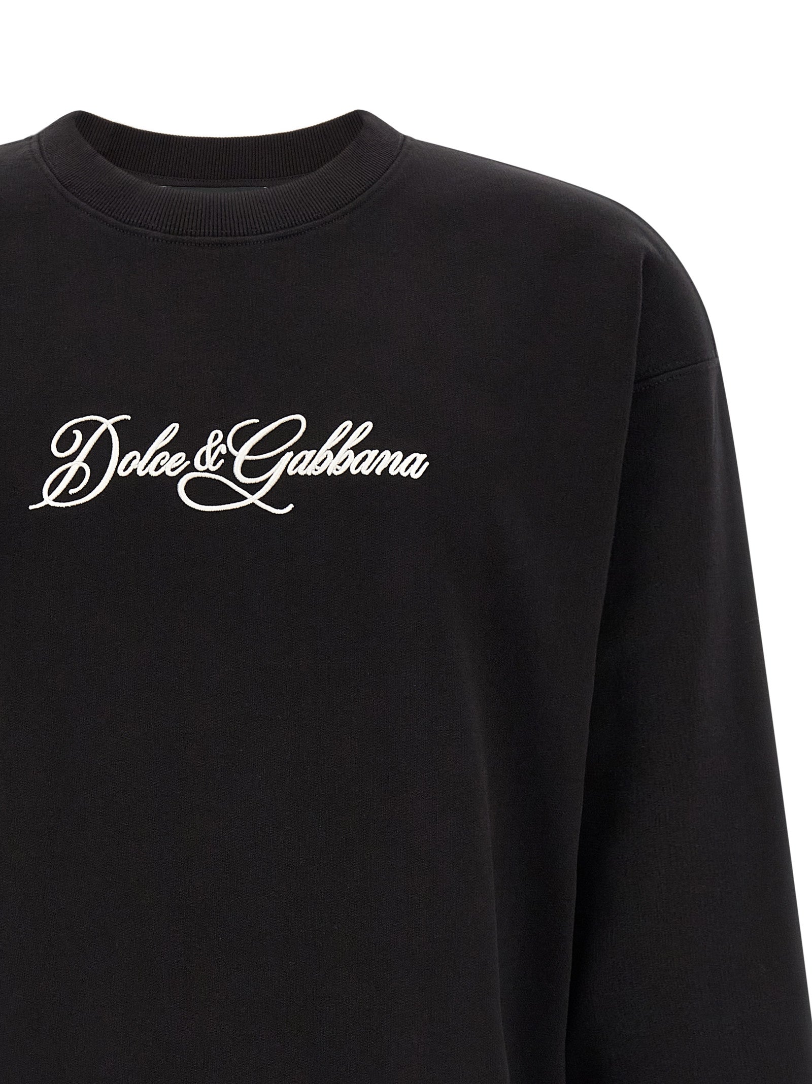 Experience the allure of Dolce & Gabbana's Black Cotton Sweatshirt, a masterpiece of Italian craftsmanship that embodies effortless elegance and sophisticated style.