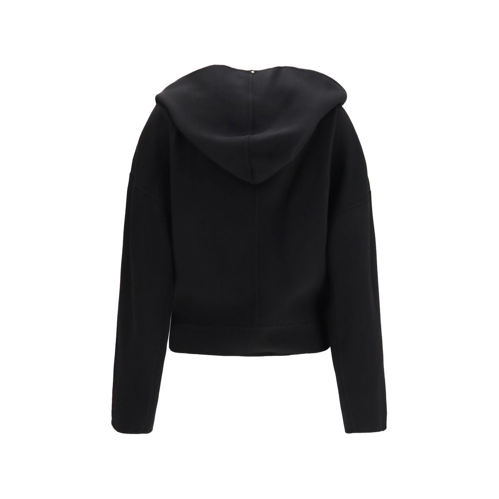 Indulge in the sophistication of the Max Mara Black Wool Oves Aries Full-Length Jacket, crafted from pure virgin wool, embodying timeless elegance and contemporary design.