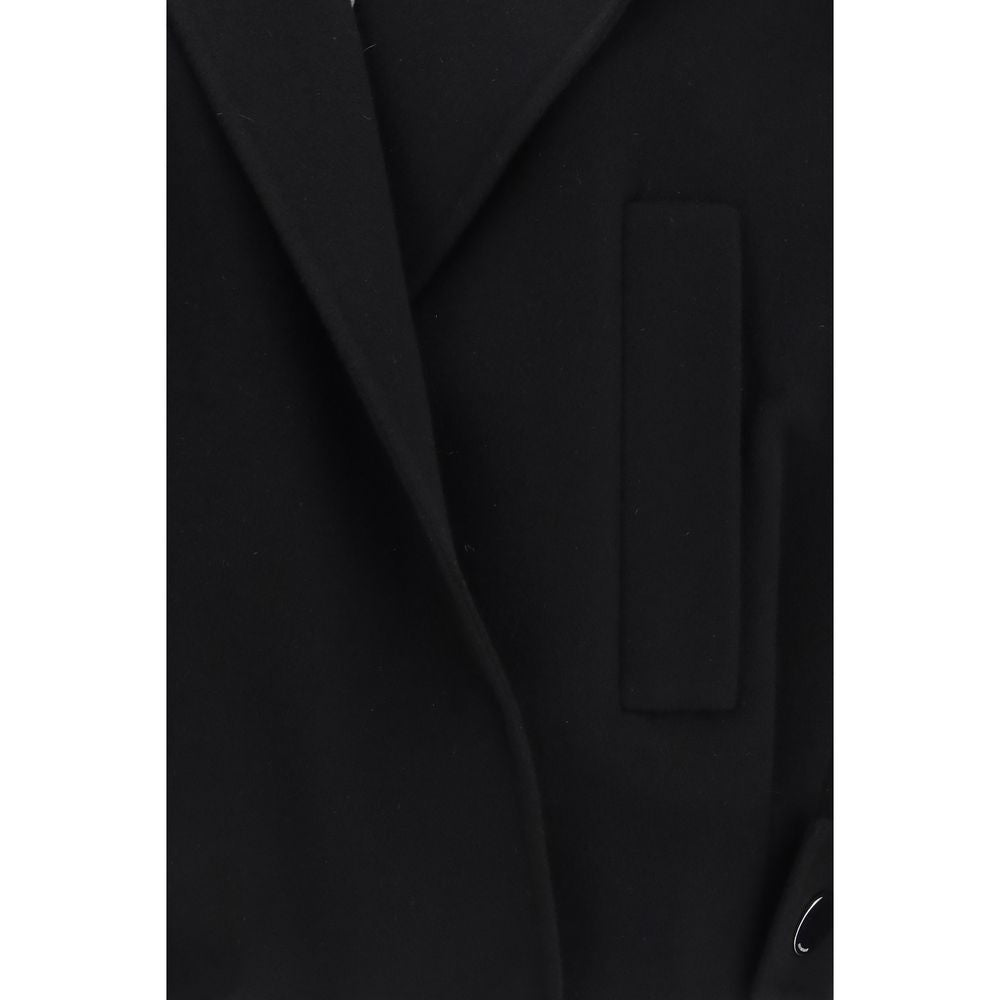 Indulge in the elegance of the Max Mara Black Wool Oves Aries Full-Length Jacket, crafted from pure virgin wool, embodying sophistication and timeless allure for discerning tastes.