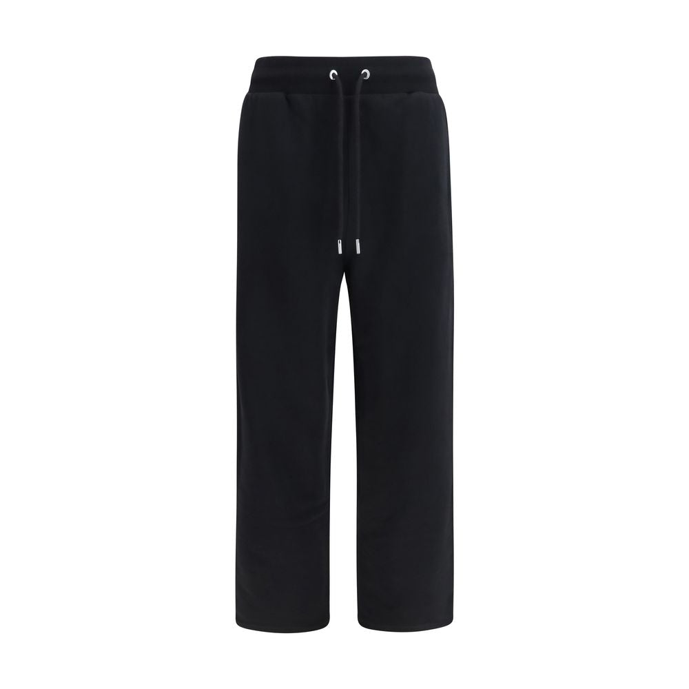 Indulge in the refined elegance of Ami Paris Black Cotton Joggers, crafted from soft cotton for a relaxed fit, perfect for sophisticated everyday style.