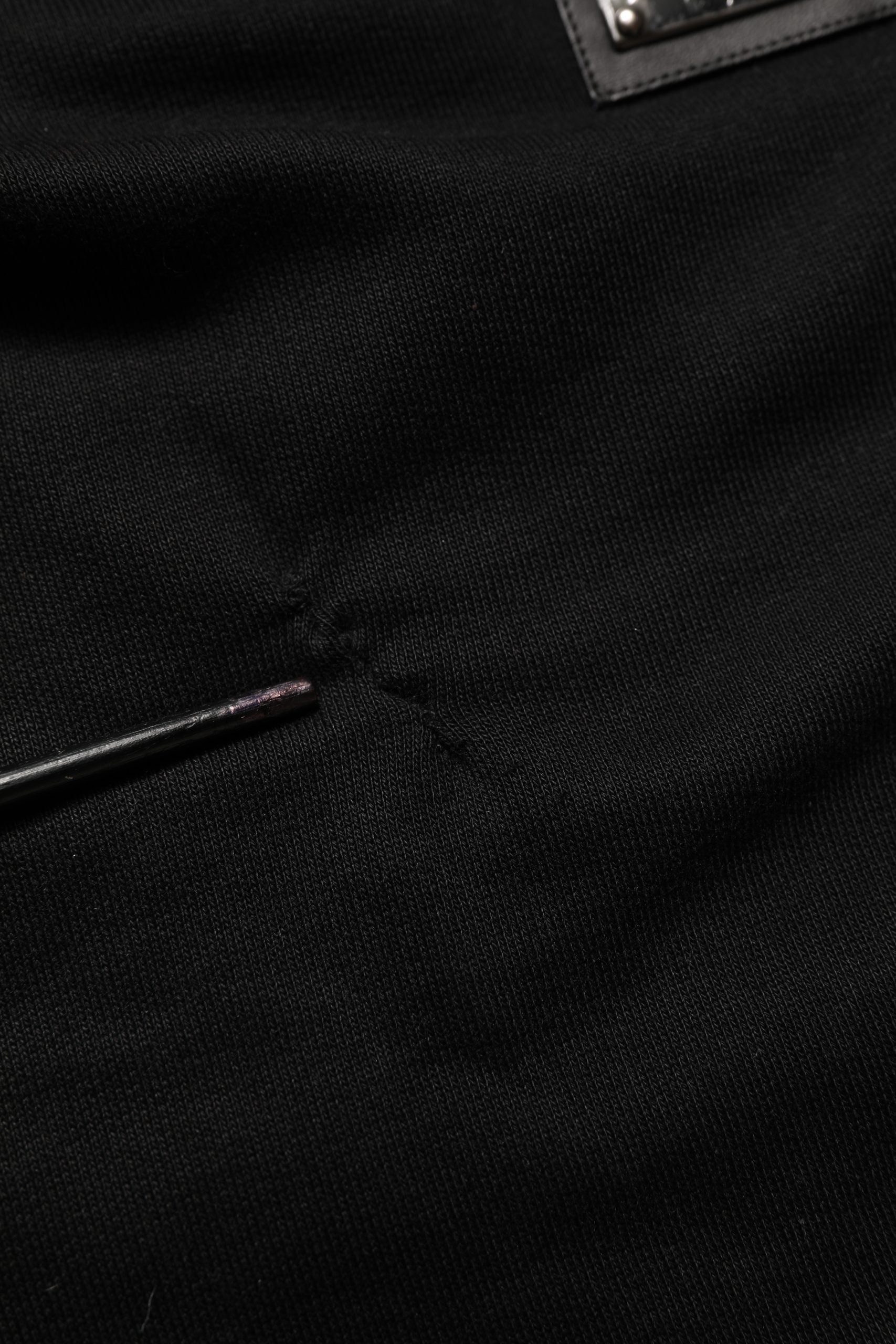 Indulge in the exquisite allure of Dolce & Gabbana's Black Cotton Logo Jogger Sweatpants, where luxurious craftsmanship meets timeless elegance for the discerning individual.