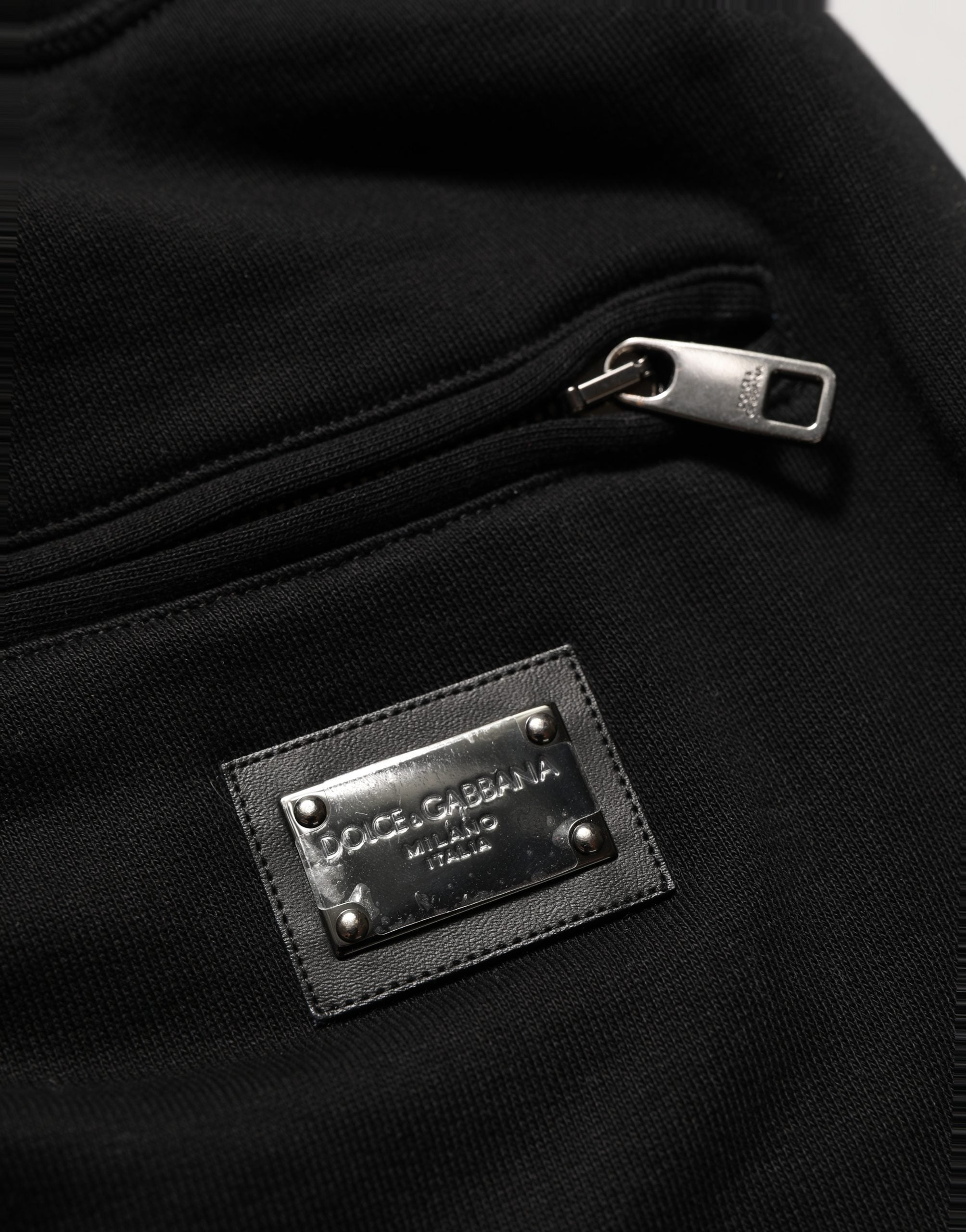 Indulge in the exquisite allure of Dolce & Gabbana's Black Cotton Logo Jogger Sweatpants, where luxurious craftsmanship meets timeless elegance for the discerning individual.