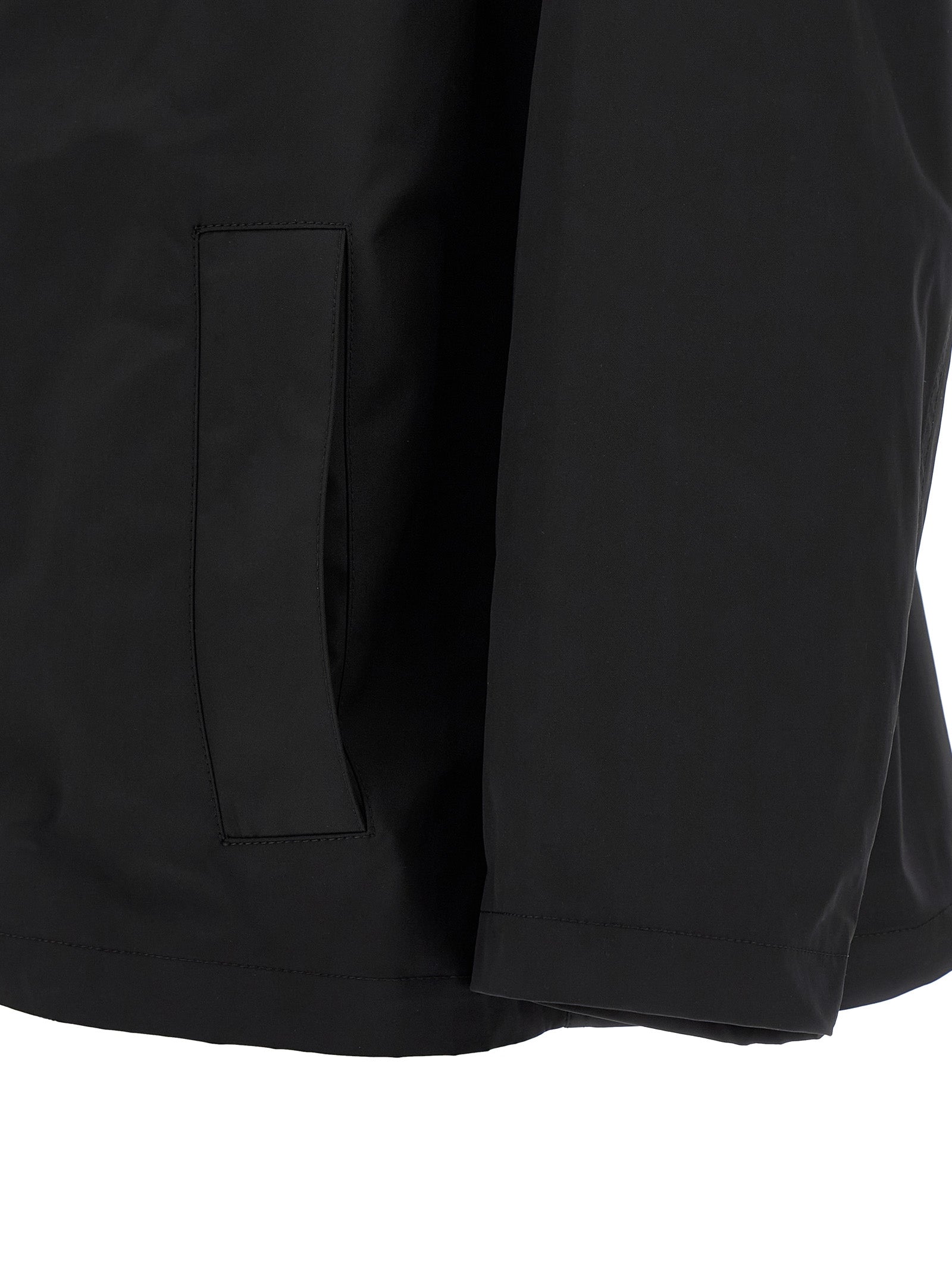 Elevate your style with the Balenciaga Black Polyester Parka, a masterful blend of modern aesthetics and functionality, crafted for the discerning individual.