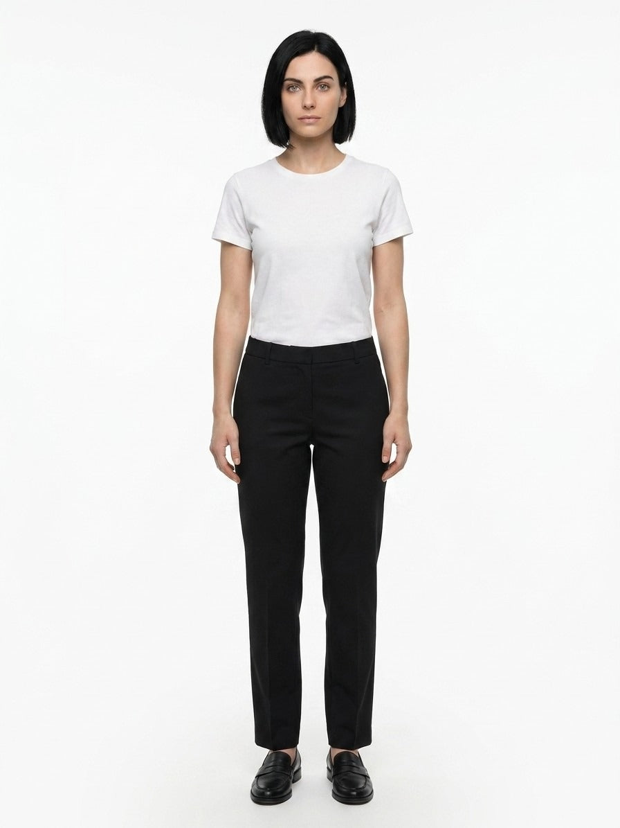 Indulge in the sophistication of Dolce & Gabbana's Black Cotton Casual Pants, crafted in Italy for a flawless fit that embodies timeless elegance and luxury.