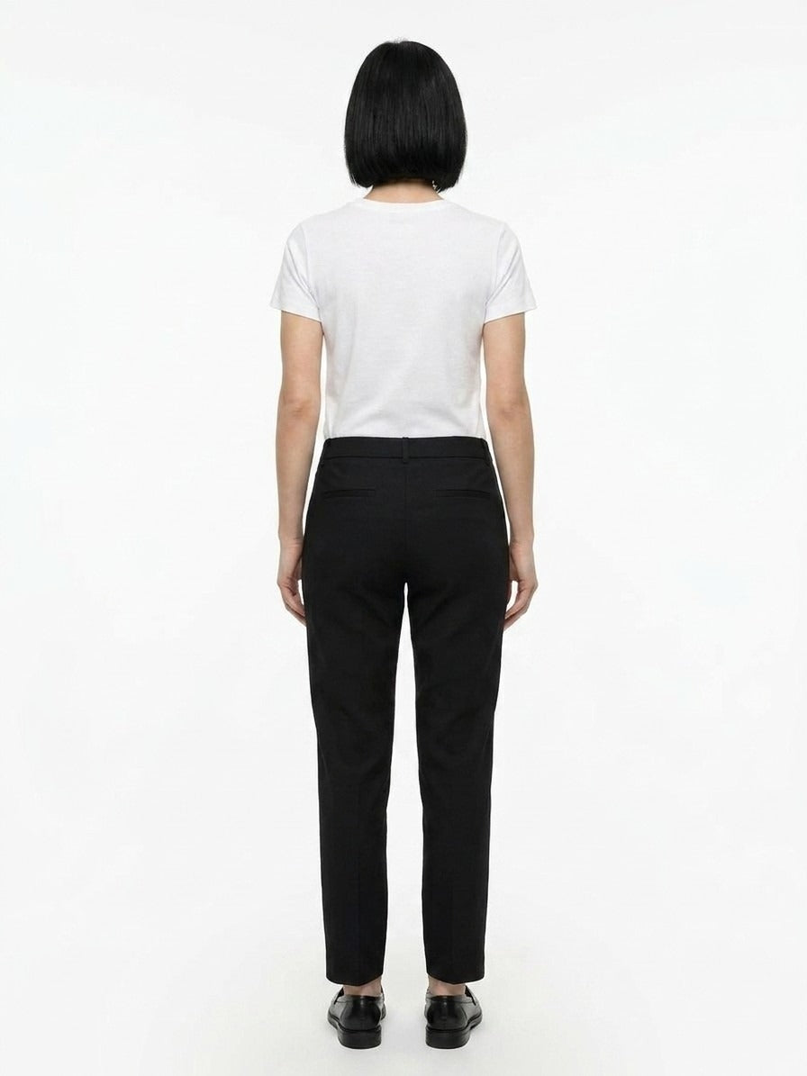 Indulge in the timeless elegance of Dolce & Gabbana's Black Cotton Casual Pants, where luxurious craftsmanship meets versatile sophistication for the discerning individual.