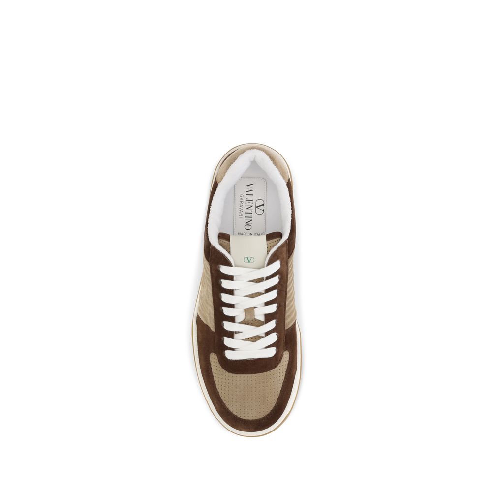 Indulge in the exquisite craftsmanship of Valentino Garavani's Brown Napa Leather Sneakers, where luxurious materials meet timeless elegance for the discerning individual.